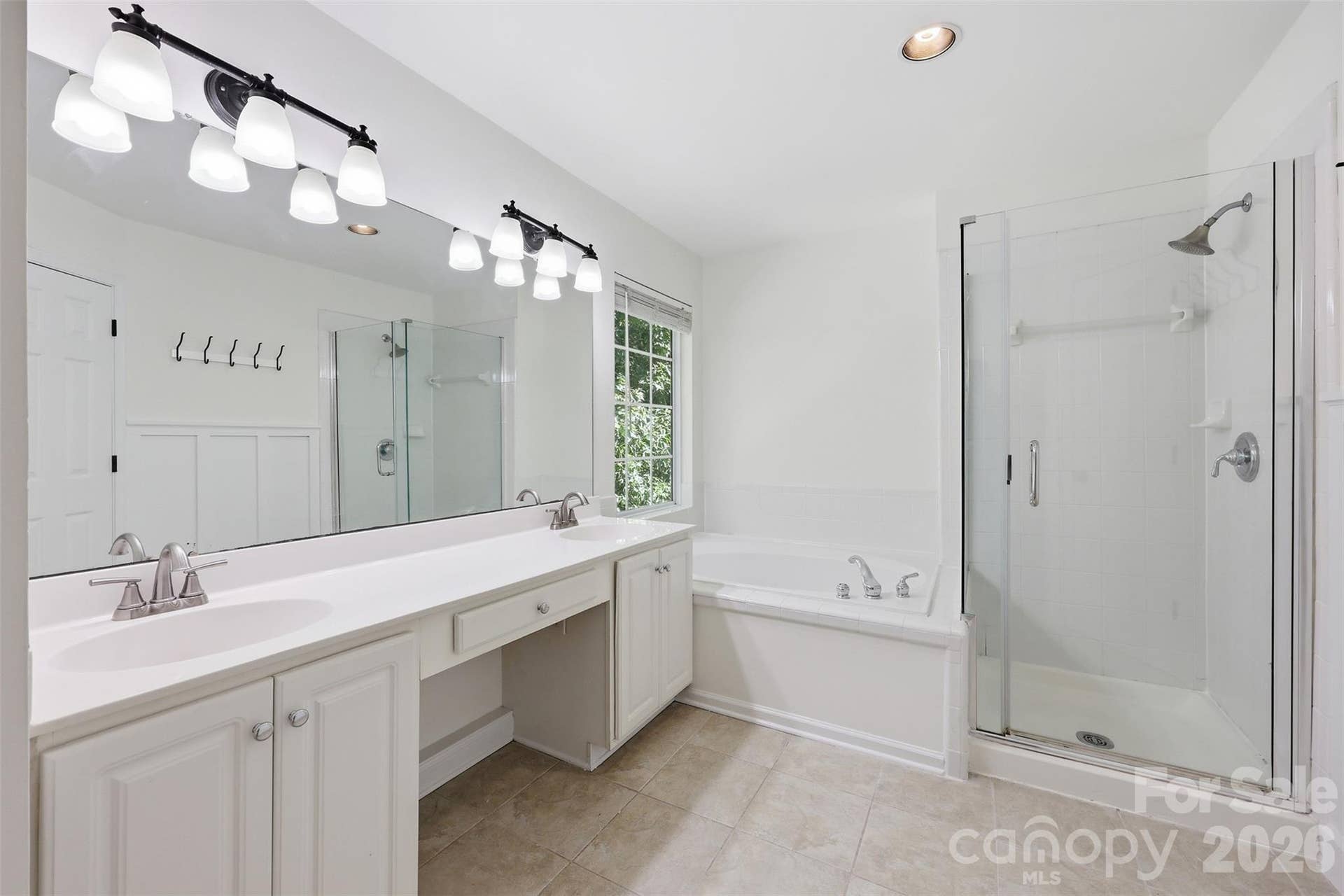 6832 Charter Hills Road, Charlotte, NC 28277 Primary bath features a dual sink vanity, a relaxing soaking tub, and a separate walk-in shower!