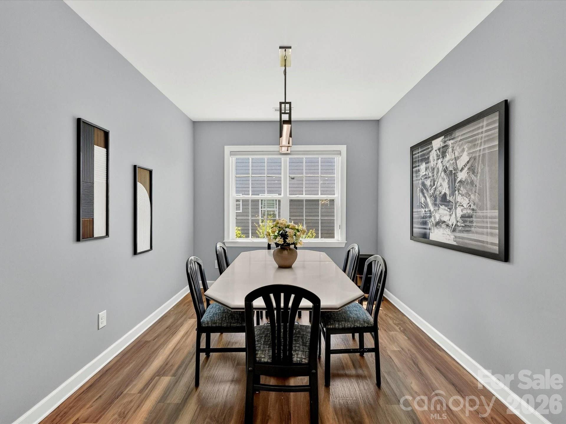 Breakfast Room with LVP Flooring and Modern Light Fixture