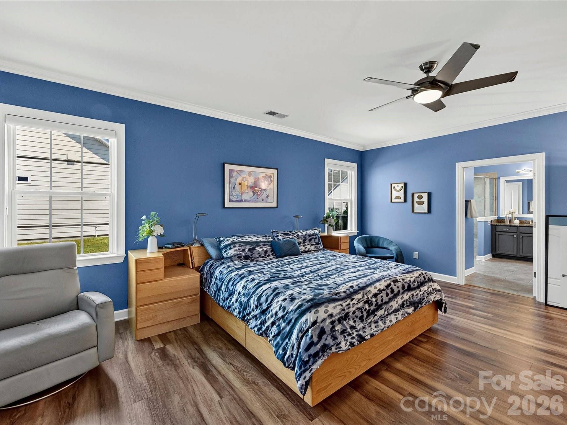 Primary Bedroom with Fan and LVP Flooring