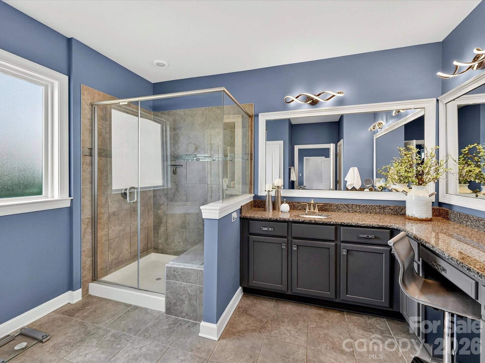 Primary Bath with Tiled Flooring, Tiled Shower Surround and Tiled Sitting Bench in Shower