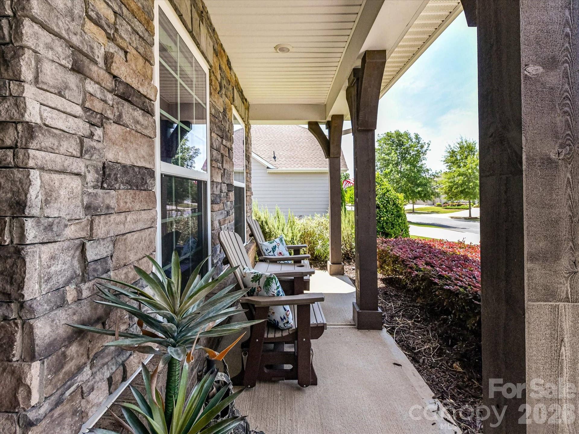 Large Covered Front Porch to enjoy your Morning Coffee