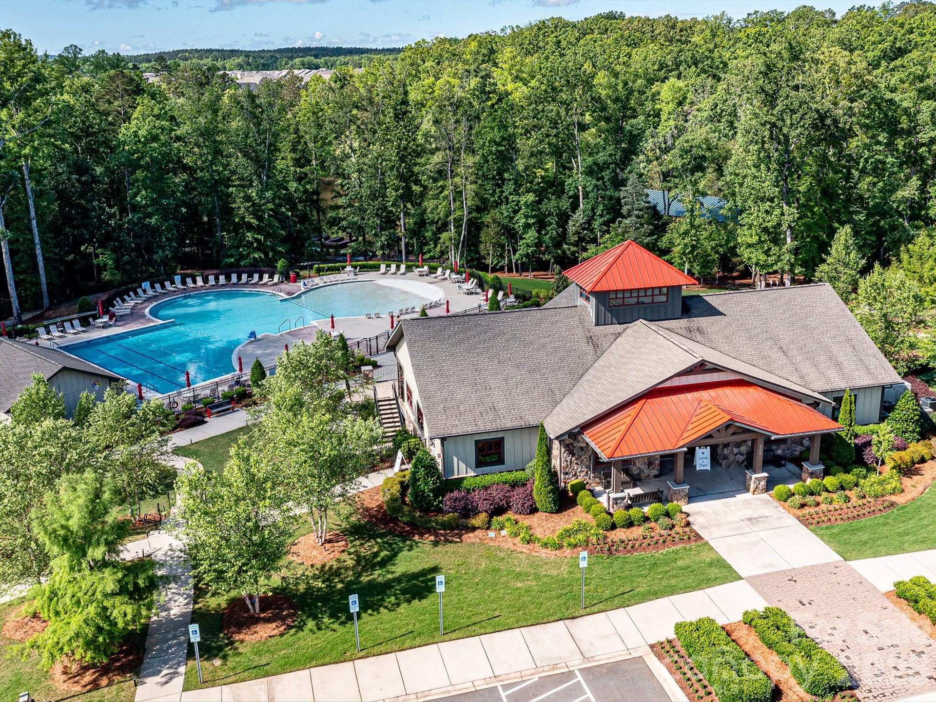 Two Level Clubhouse with Social Room and kitchen plus Lower-Level Fitness. Inground Zero Entry Pool with Lap Lanes. Pickleball, Tennis and Bocce Courts too