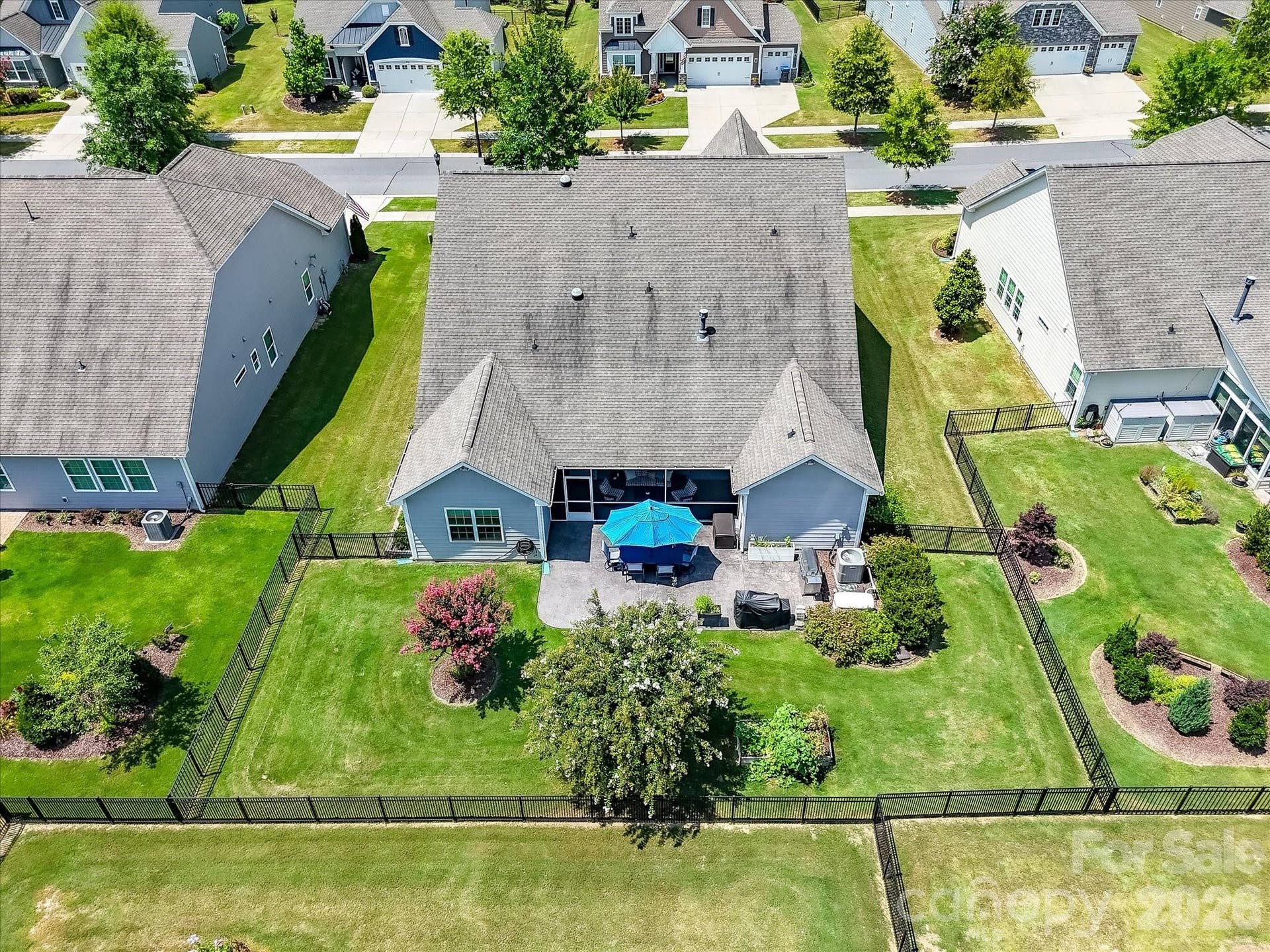 Drone View of Rear Landscaping, Patio, Fence and Home