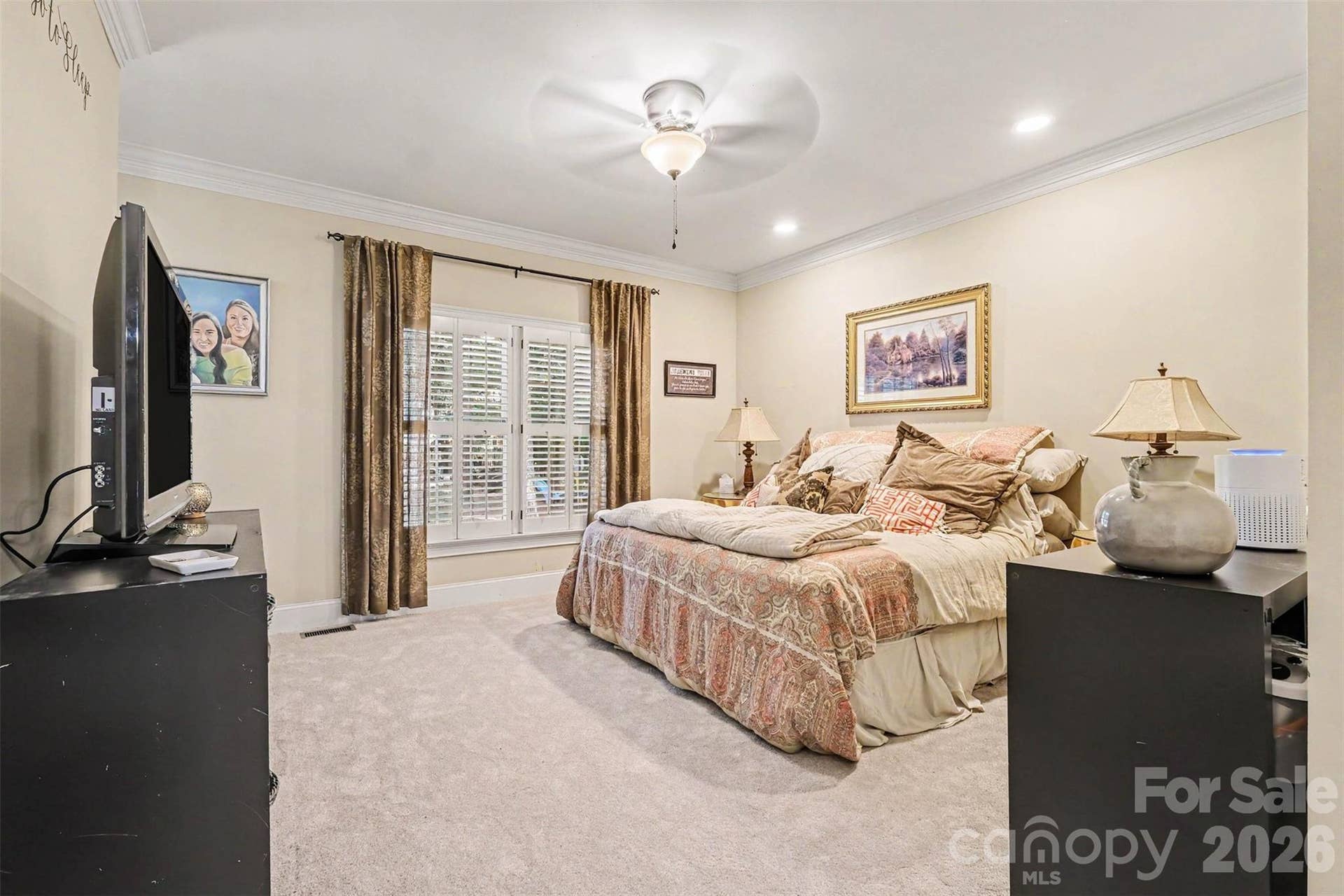 Primary Bedroom on main floor with separate exit to back porch