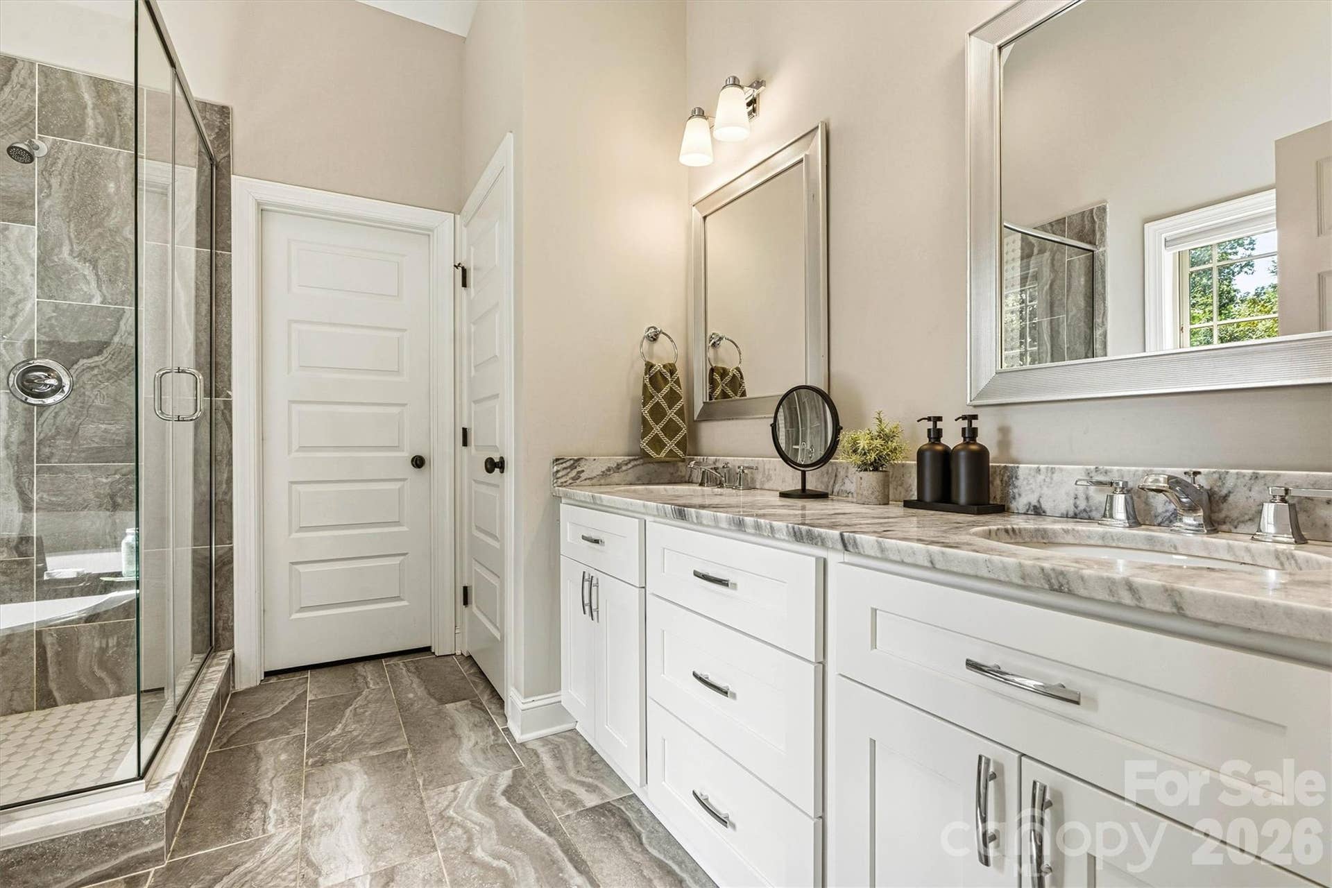 Ensuite Primary bath with tile shower and dual vanity