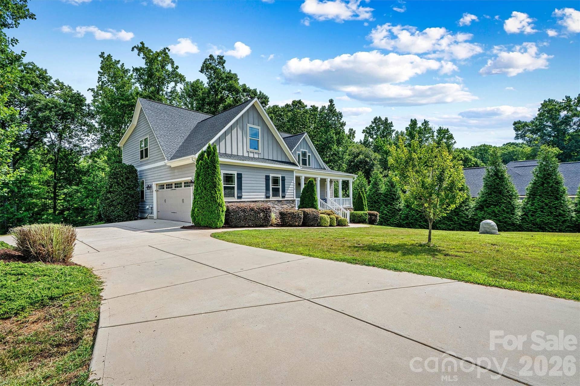 Located in a cul-de-sac with an acre of property that has mature trees surrounding the yard