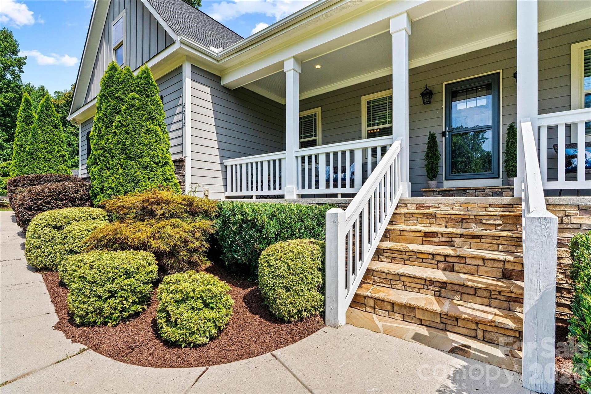 Welcoming front porch for sipping coffee in the mornings