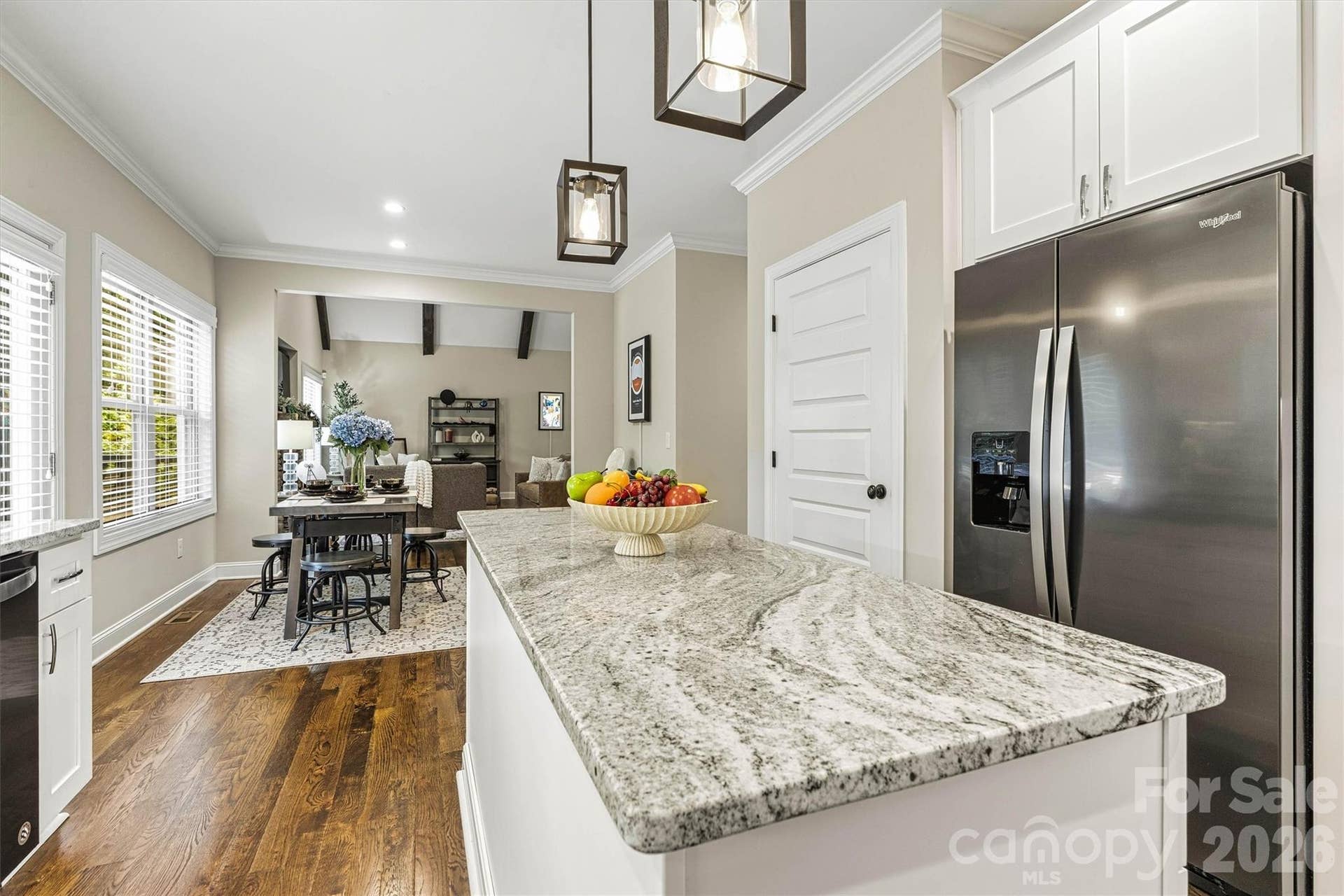 An exterior door off the kitchen leads to the expansive, newly painted back deck making eating outside seamless