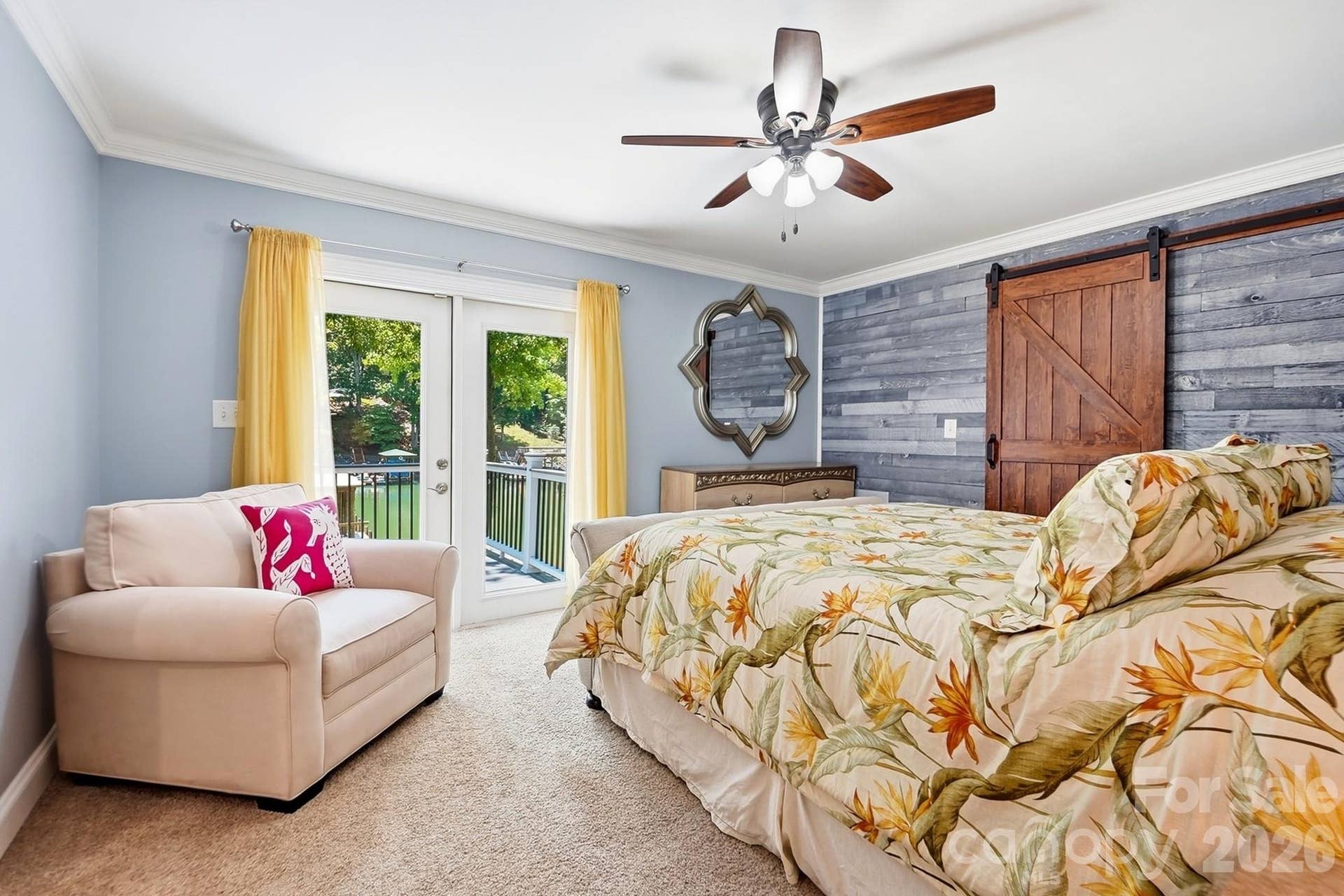 Primary suite with walk-in closet and stunning lake views