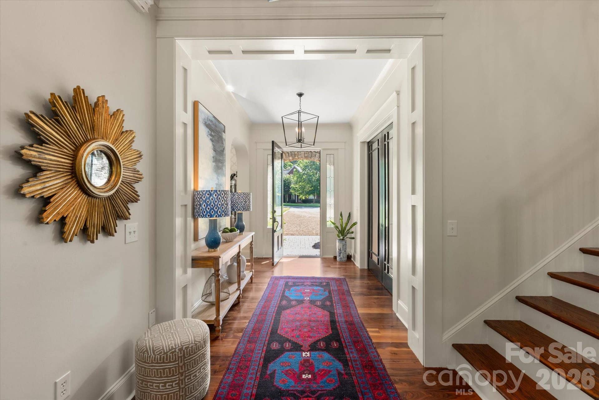 ...with stunning, pristine, wide-plank walnut floors throughout the main level.