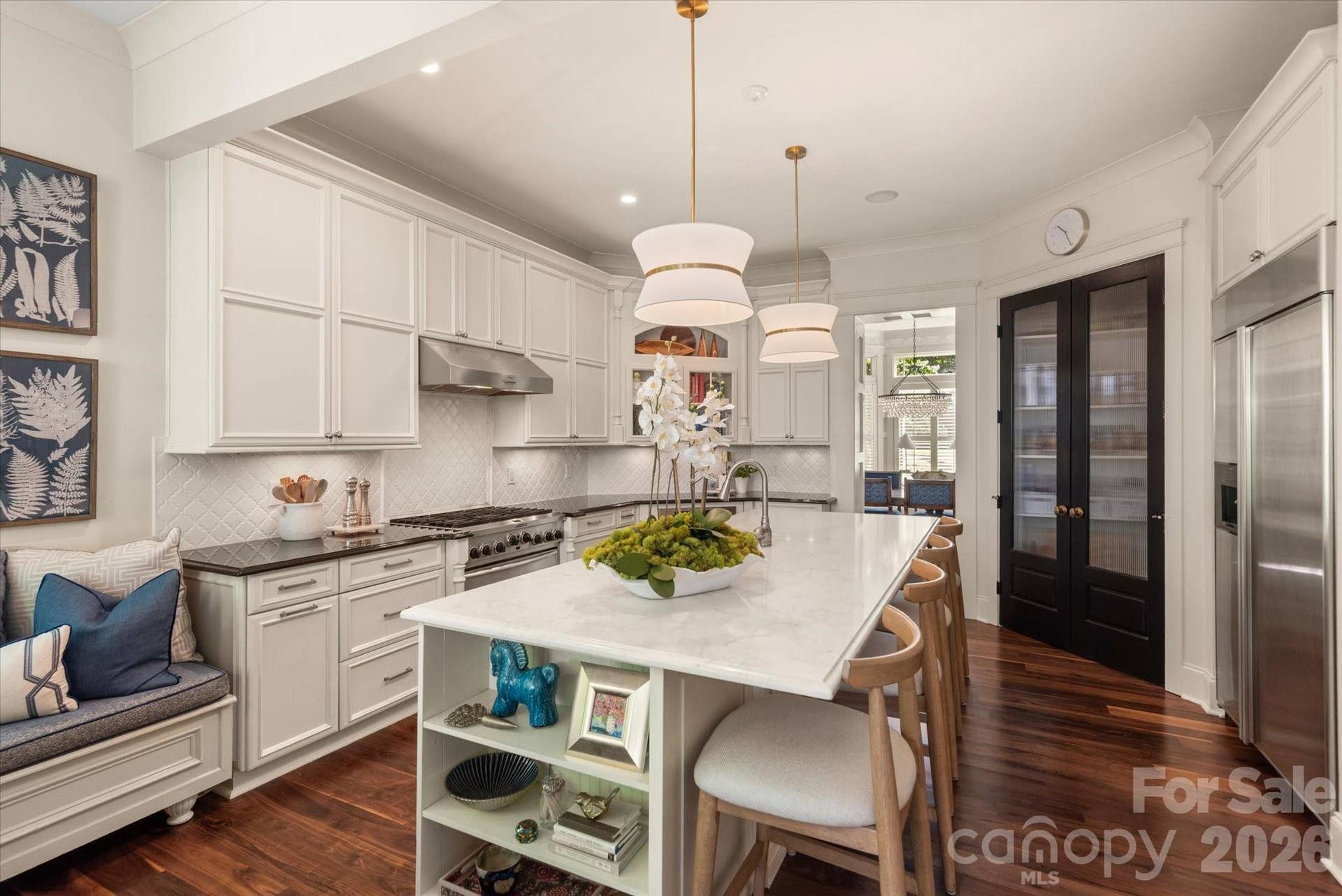 And the Kitchen boasts amazing storage with built-in cabinetry, easy access cubbies, and a full walk-in pantry.