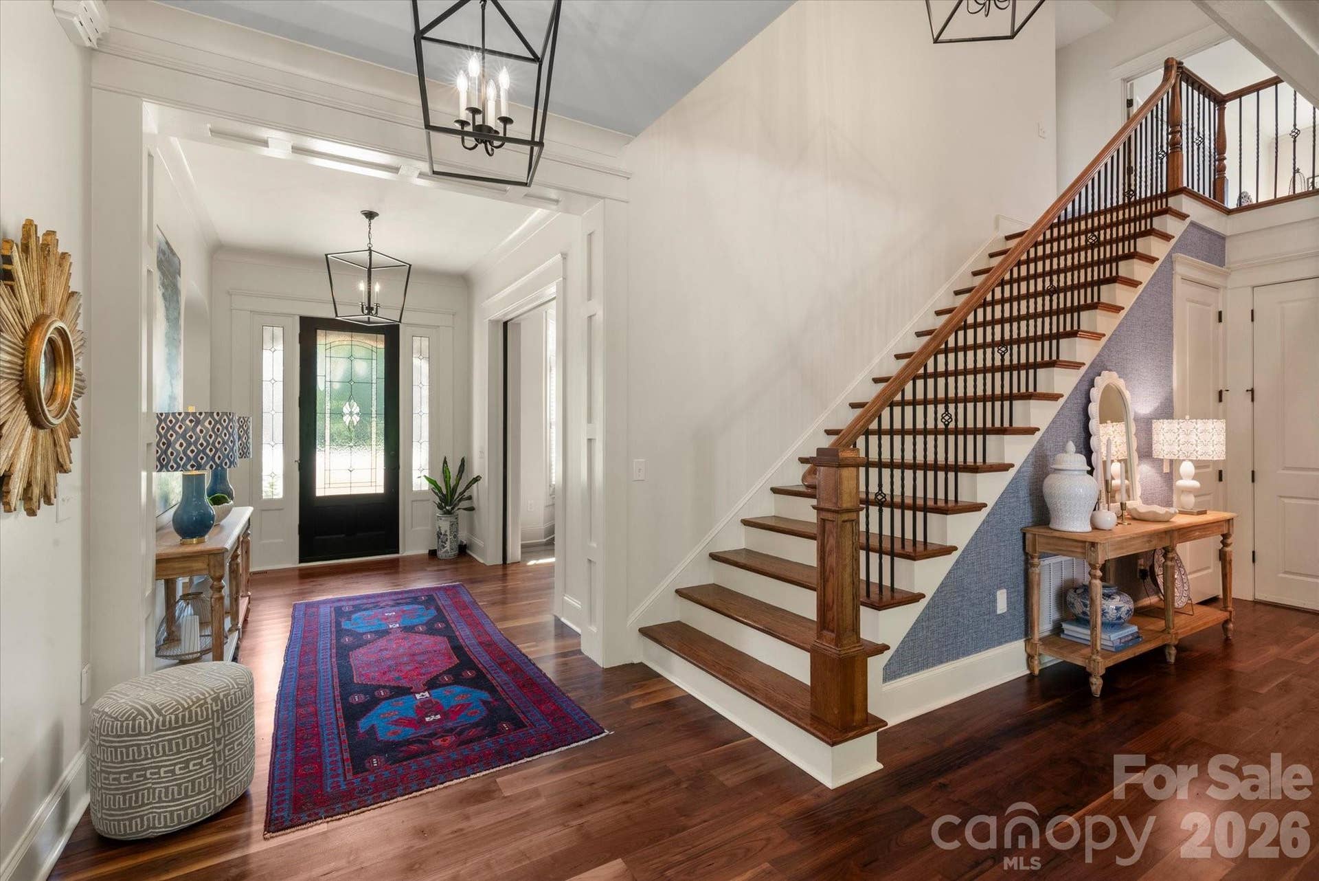 Designed with an emphasis on seamless flow, the home offers multiple elegant points of arrival, featuring a secondary garage entrance tucked quietly past the adjacent mudroom.