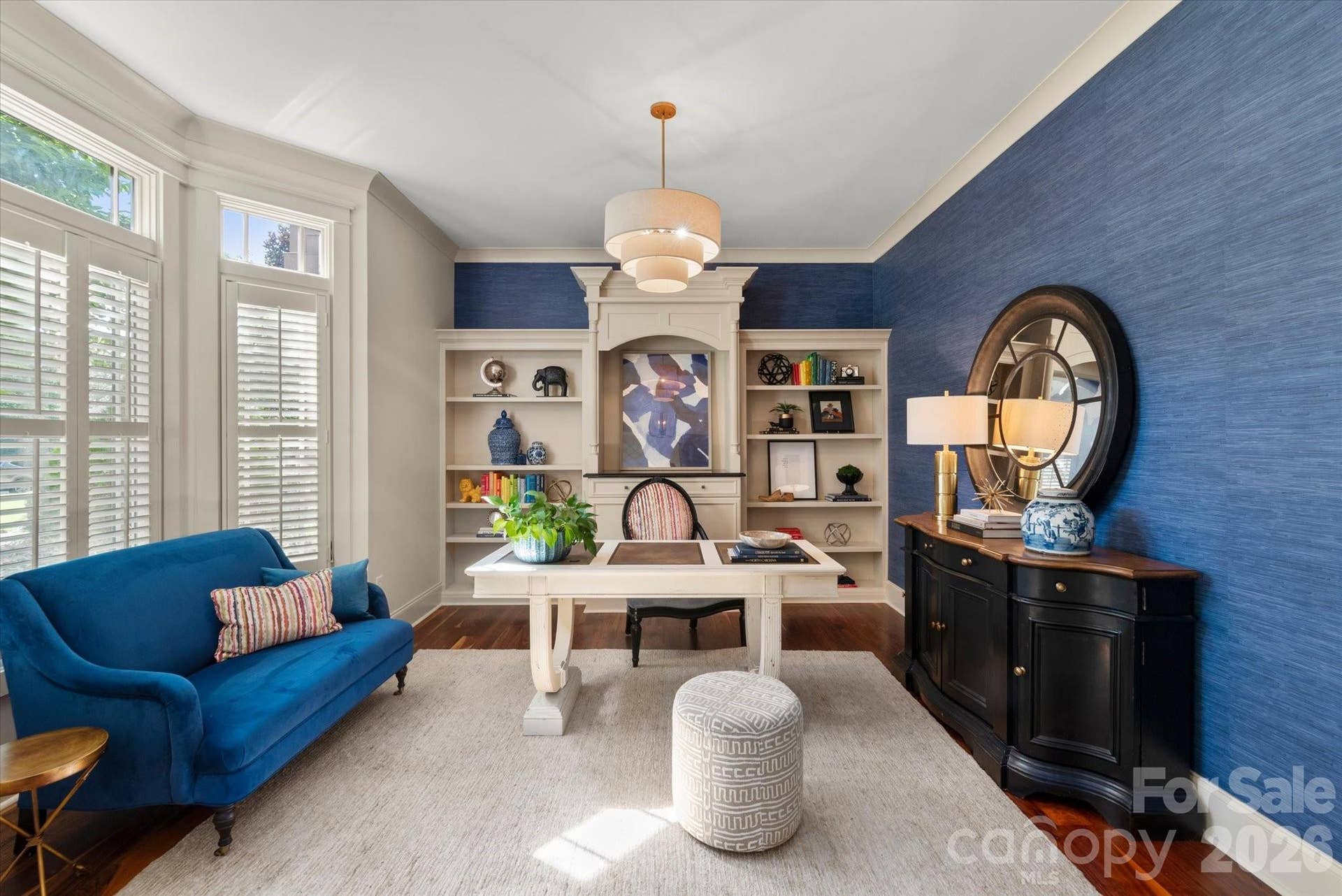 This sophisticated home office workspace offers the perfect blend of privacy and executive style with functional built-ins and stately finishes.