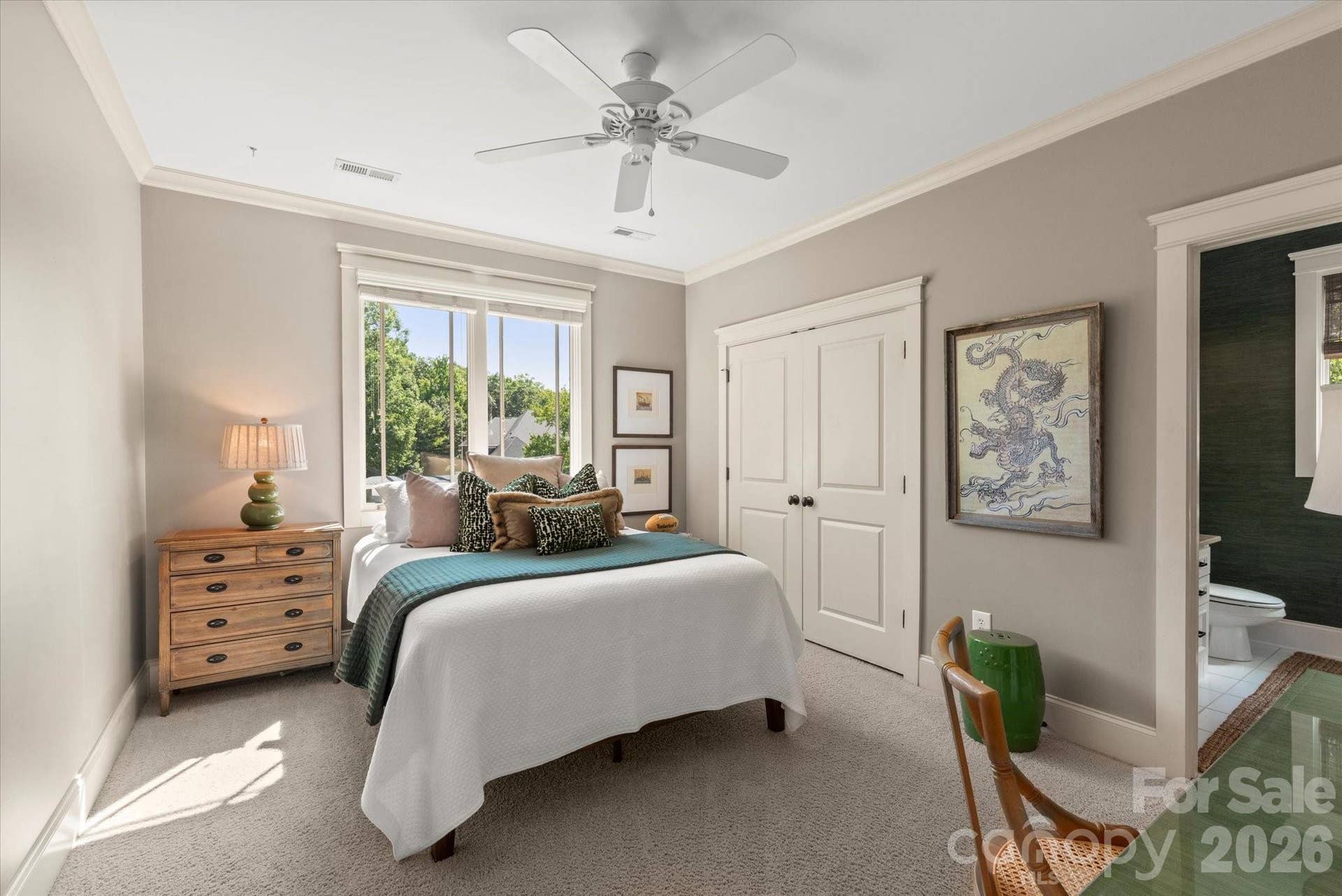 Generously proportioned secondary bedrooms offer bright windows, plush carpeting, and cascading natural light.