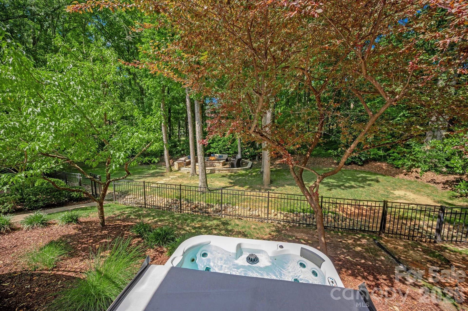 Melt the day away in a secluded, built-in hot tub designed for maximum relaxation.