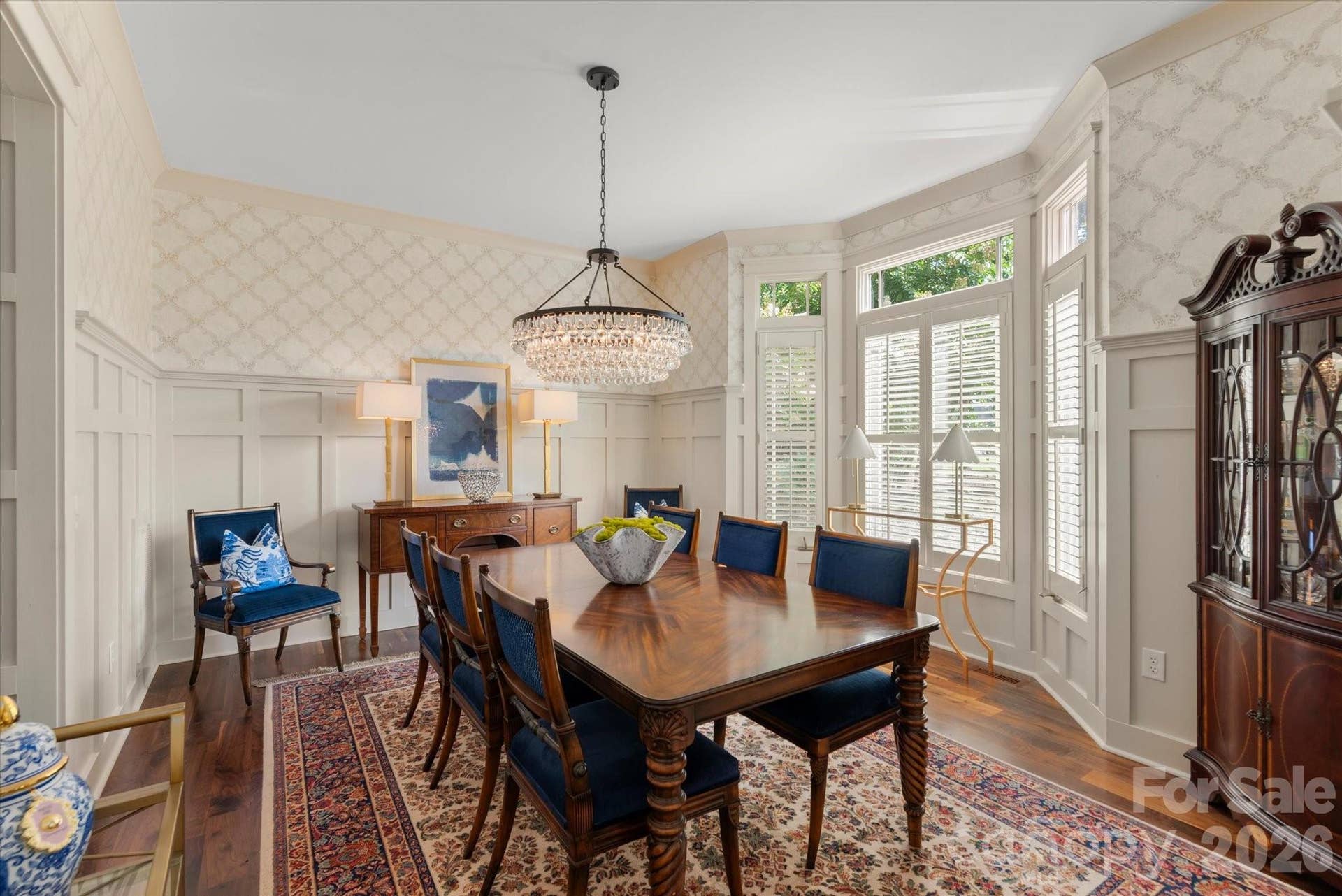 A banquet-sized Dining Room setting adorned with detail molding, ideal for hosting unforgettable formal evenings...