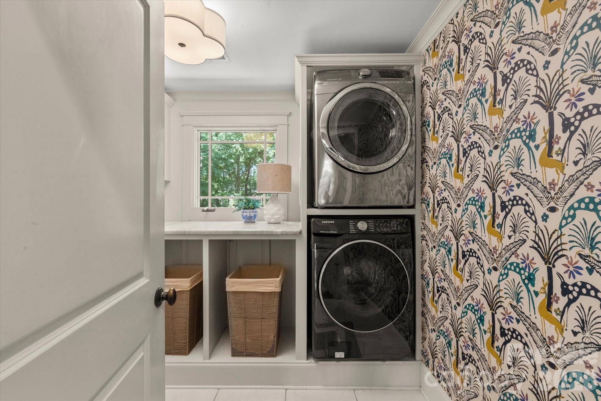 A spacious upper-level laundry center complete with integrated cabinetry and utility sink options...