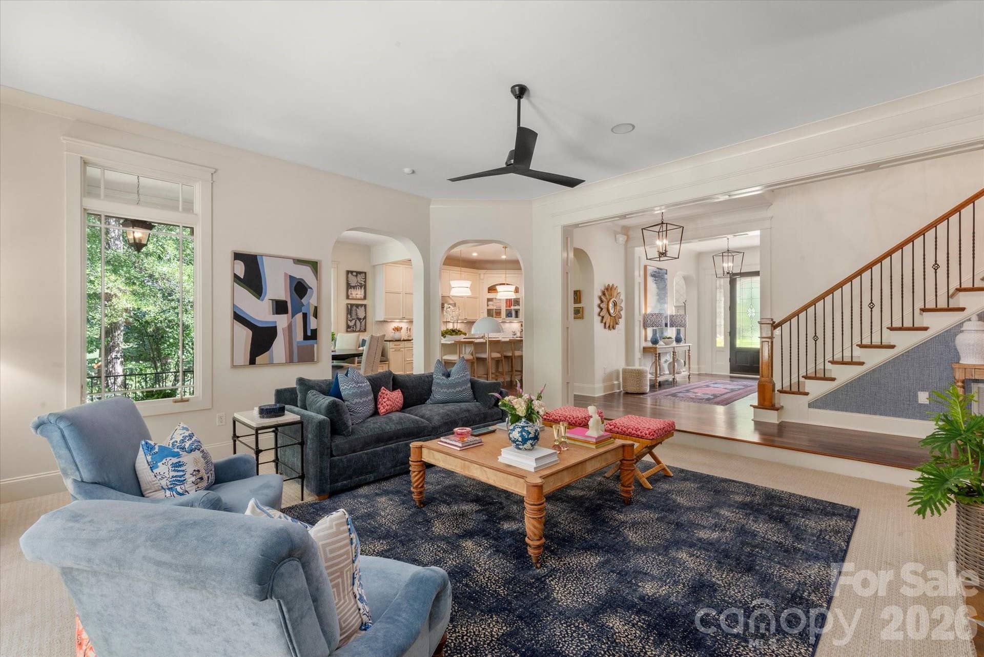 The Great Room is accessible from the entry with see-through light, from the front to the back of the property, and is open to the Kitchen.