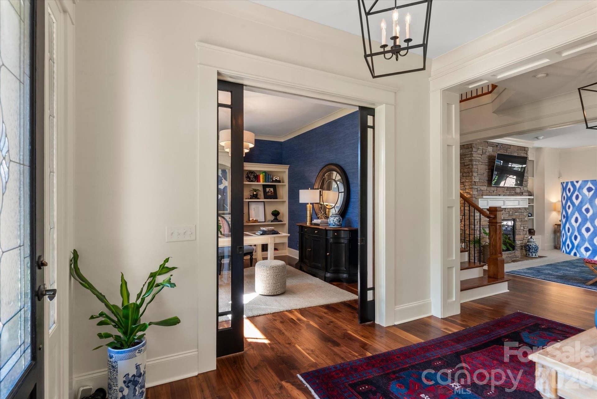 Tucked behind double pocket French doors, this sophisticated office workspace offers the perfect blend of privacy and executive style.