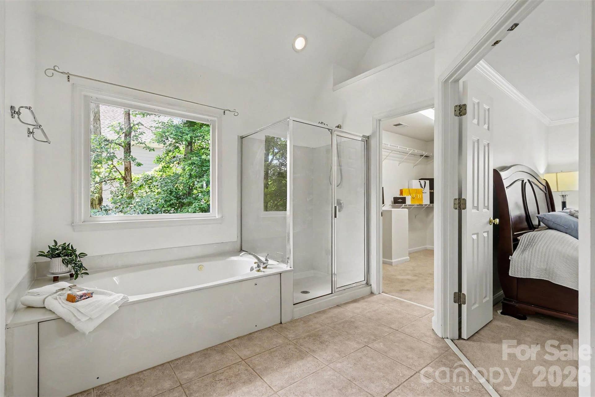 Seperate shower and soaking tub with 2 spacious walk in closets