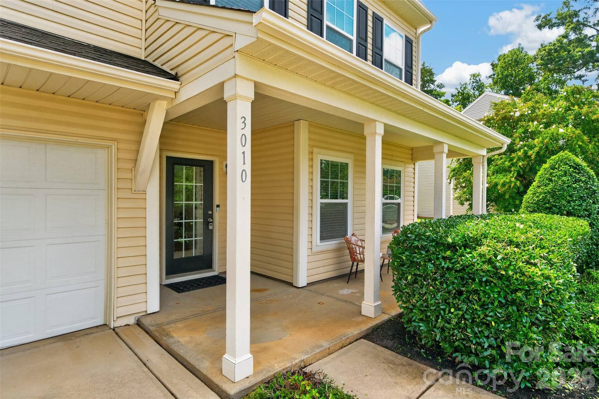 Lovely covered front porch and glass door access.
