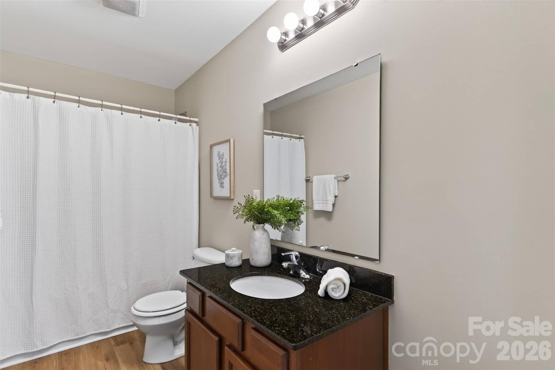 Full hall bath on second floor has a single vanity with granite top. Room to expand and install as dual vanity if desired.