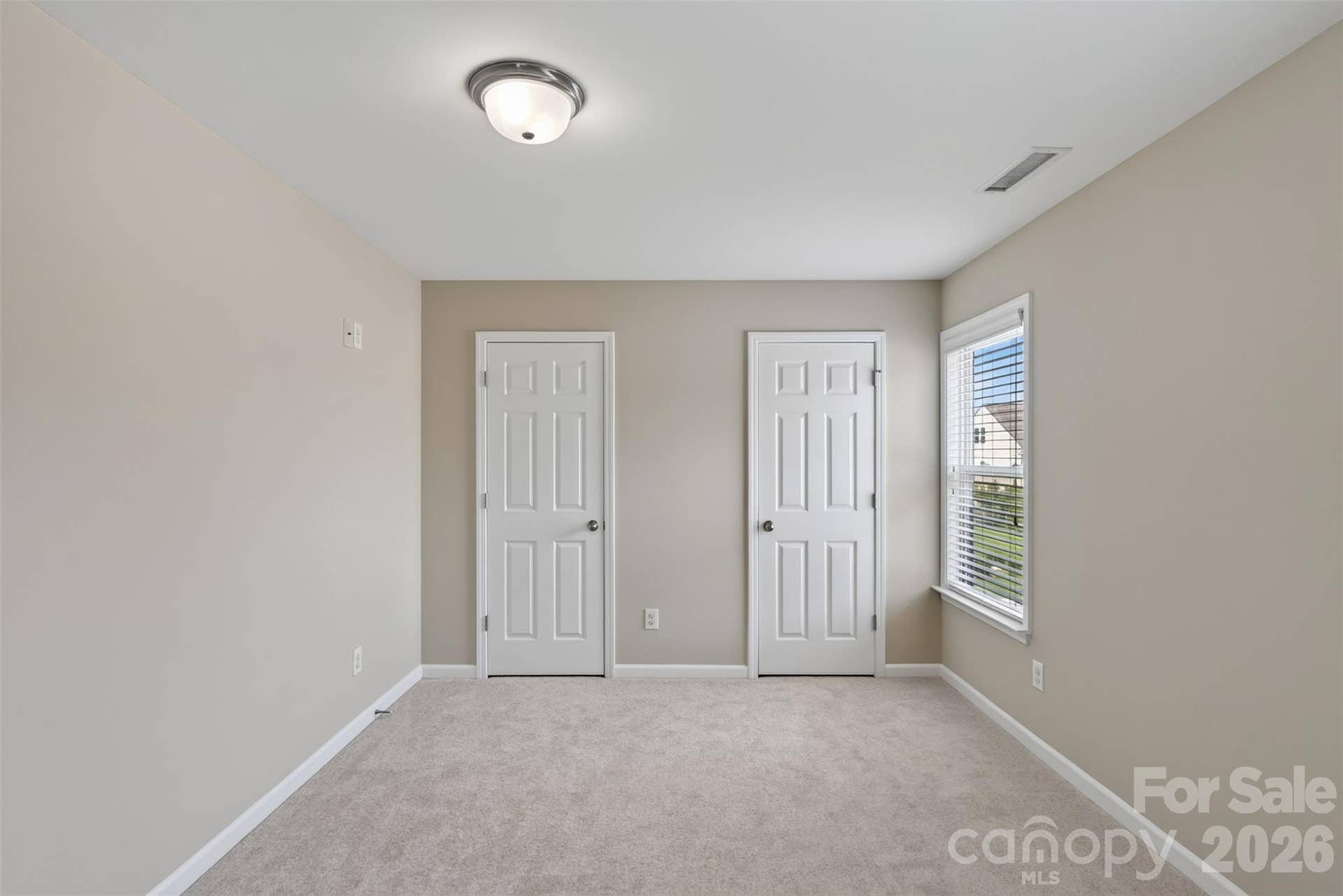 Third floor bedroom with two closets