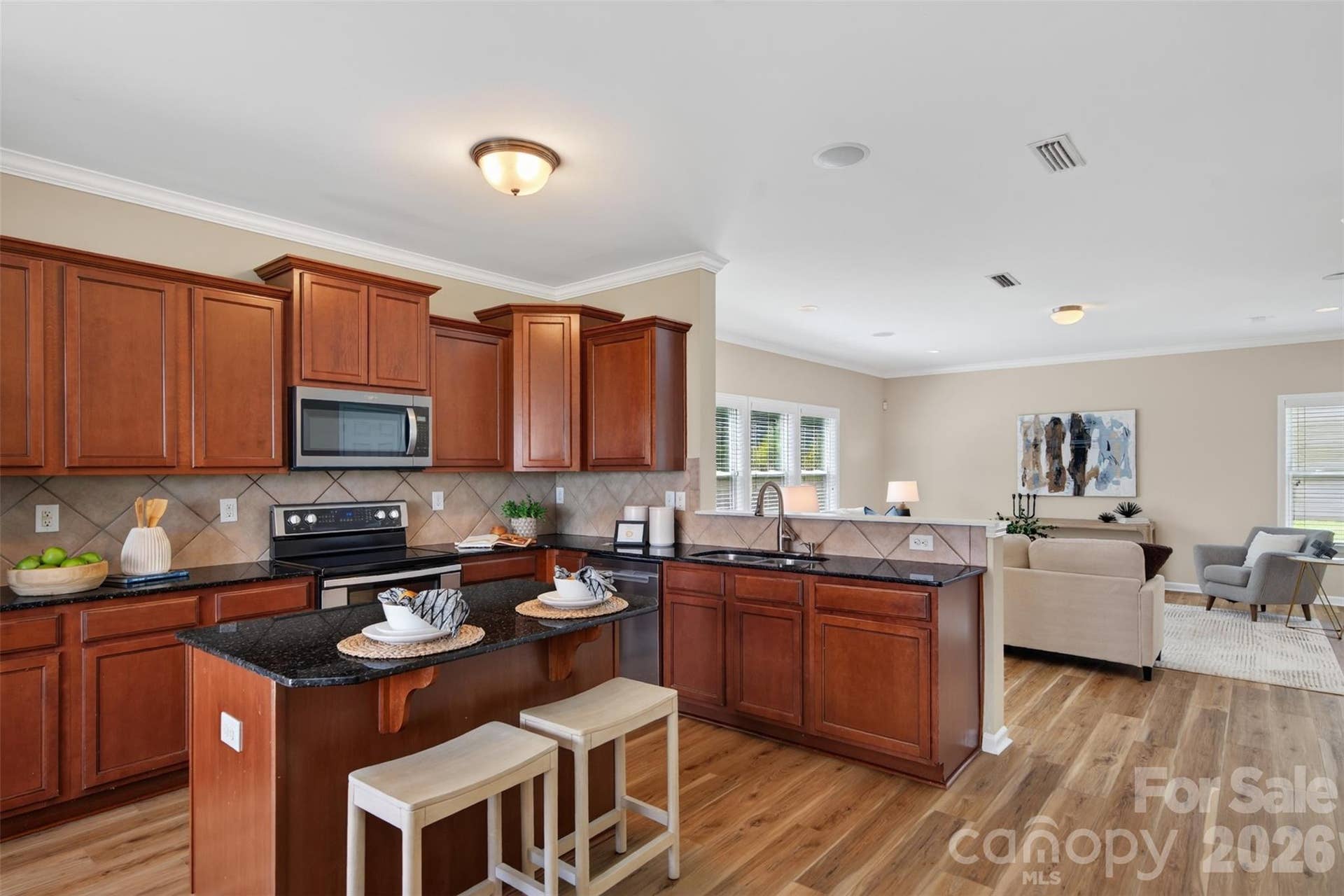 Upgraded cabinetry and stainless appliances, including a double oven