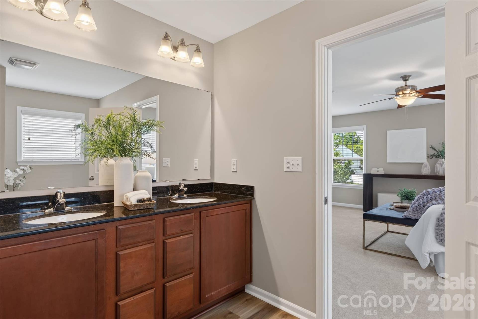 The ensuite also includes a soaking tub, walk in shower, and water closet