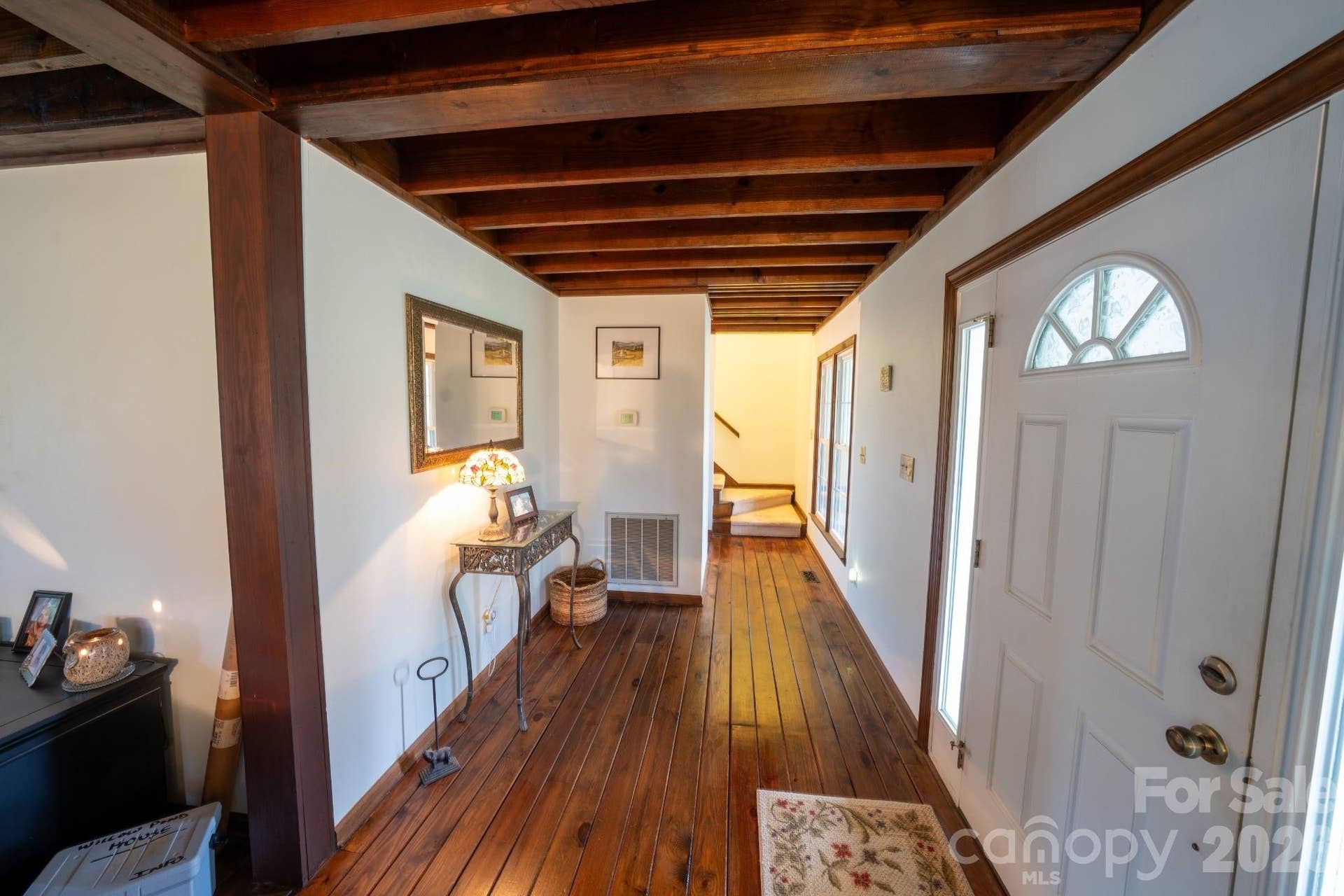 Foyer entry way with hard wood flooring