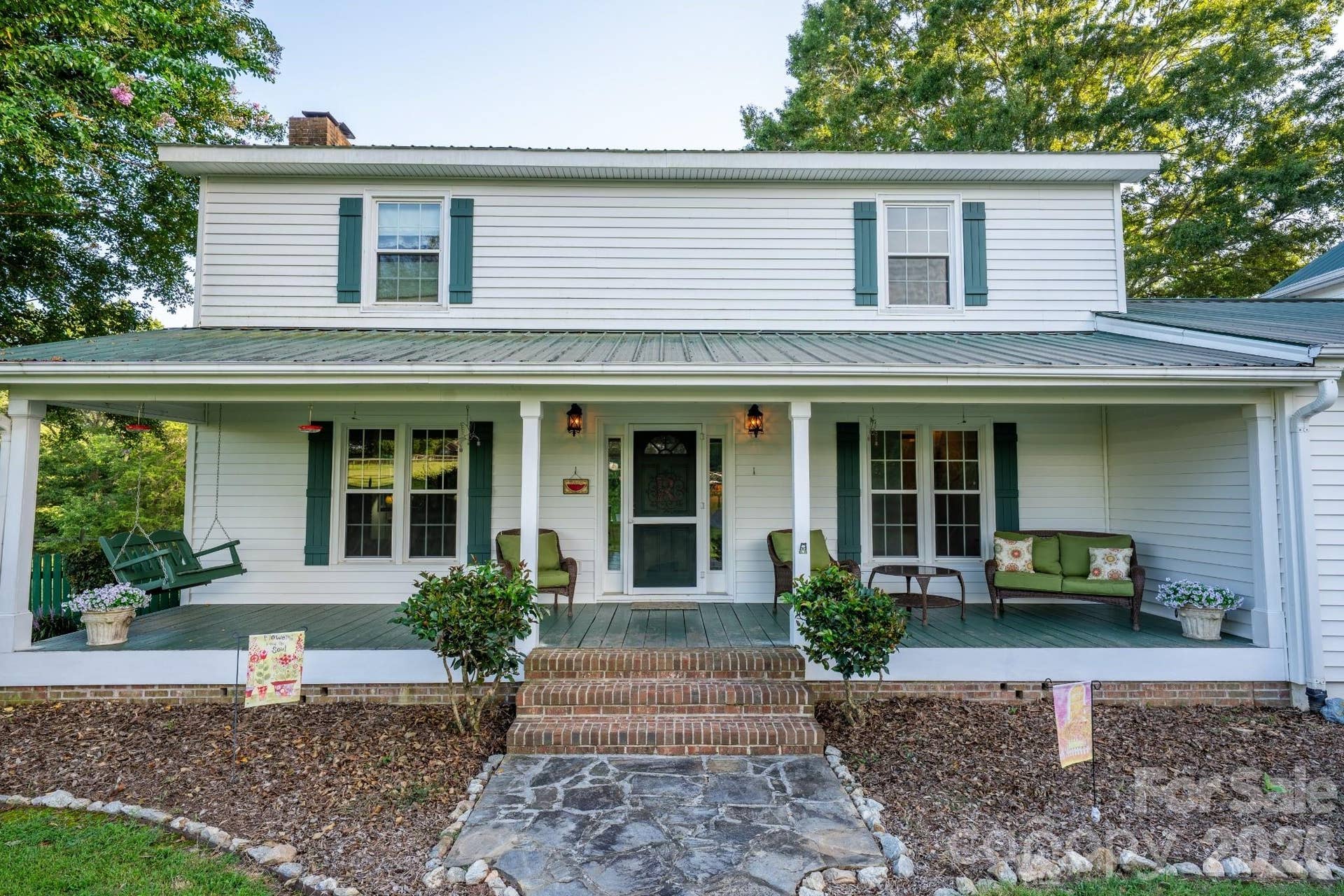 Large rocking chair front porch w/ ceiling fans, porch swing, and farm views