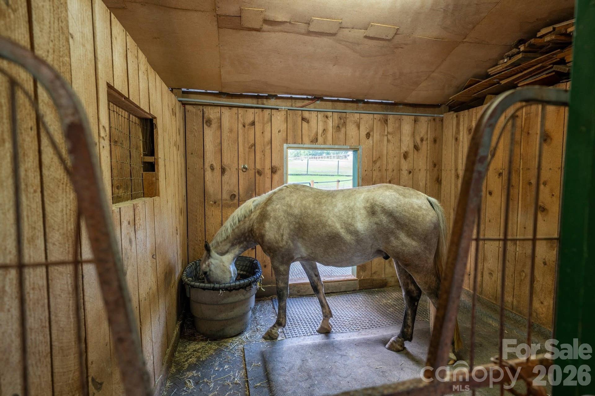 4 stalls with windows, stall mats, industrial fans, and automatic fly spray system