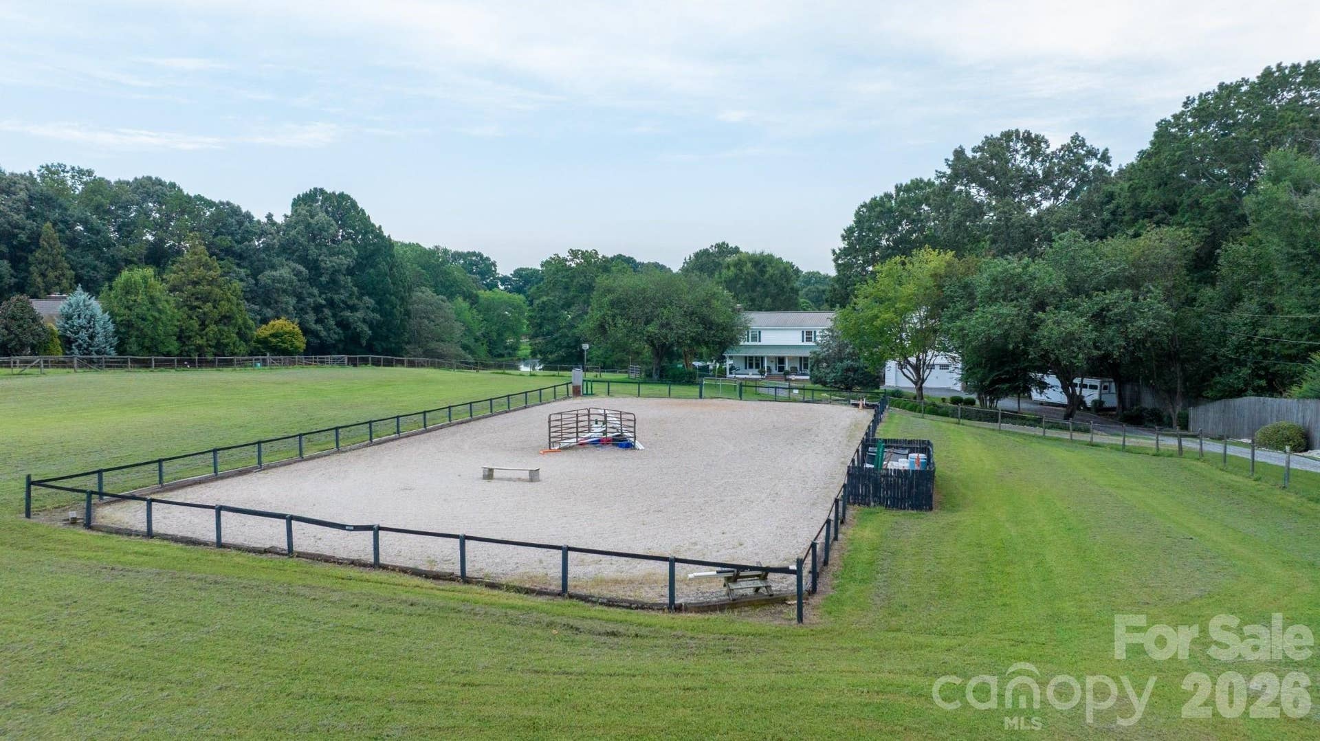 70' x 130' riding arena w/ clay base w/ Tru Tex fiber & sandstone footing