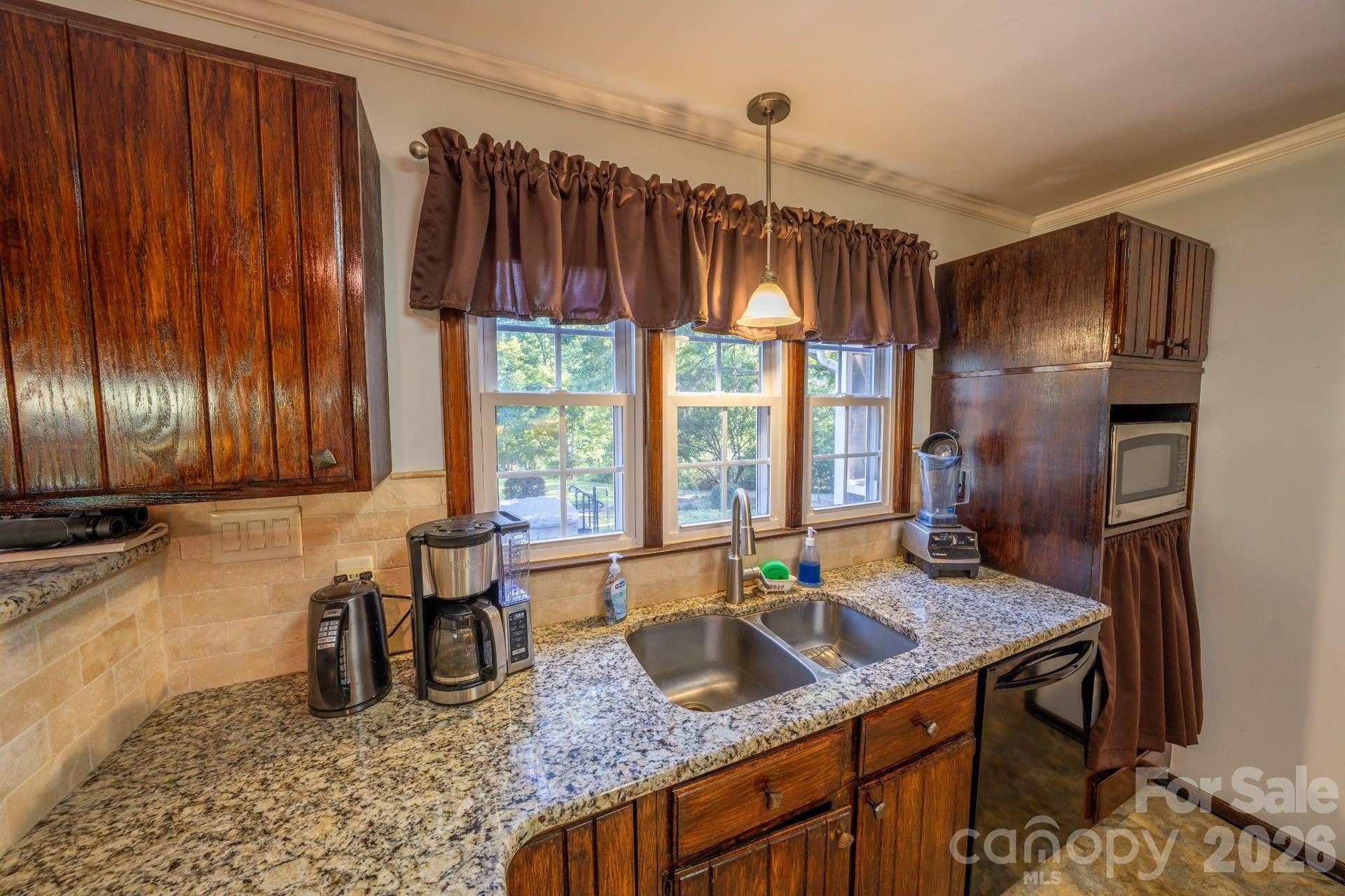 Granite countertops, stainless steel sink,