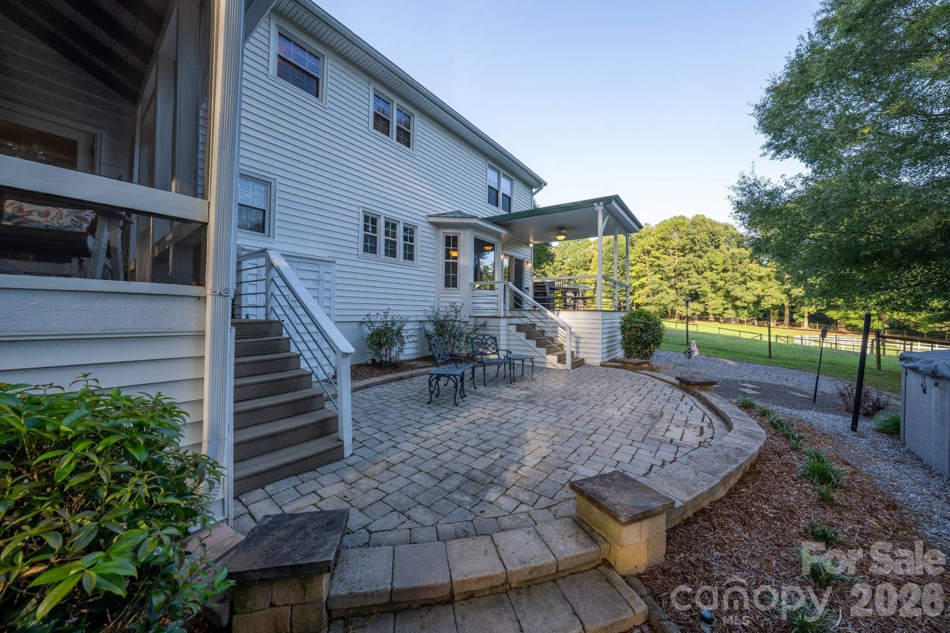 Back paver patio w/ established landscaping
