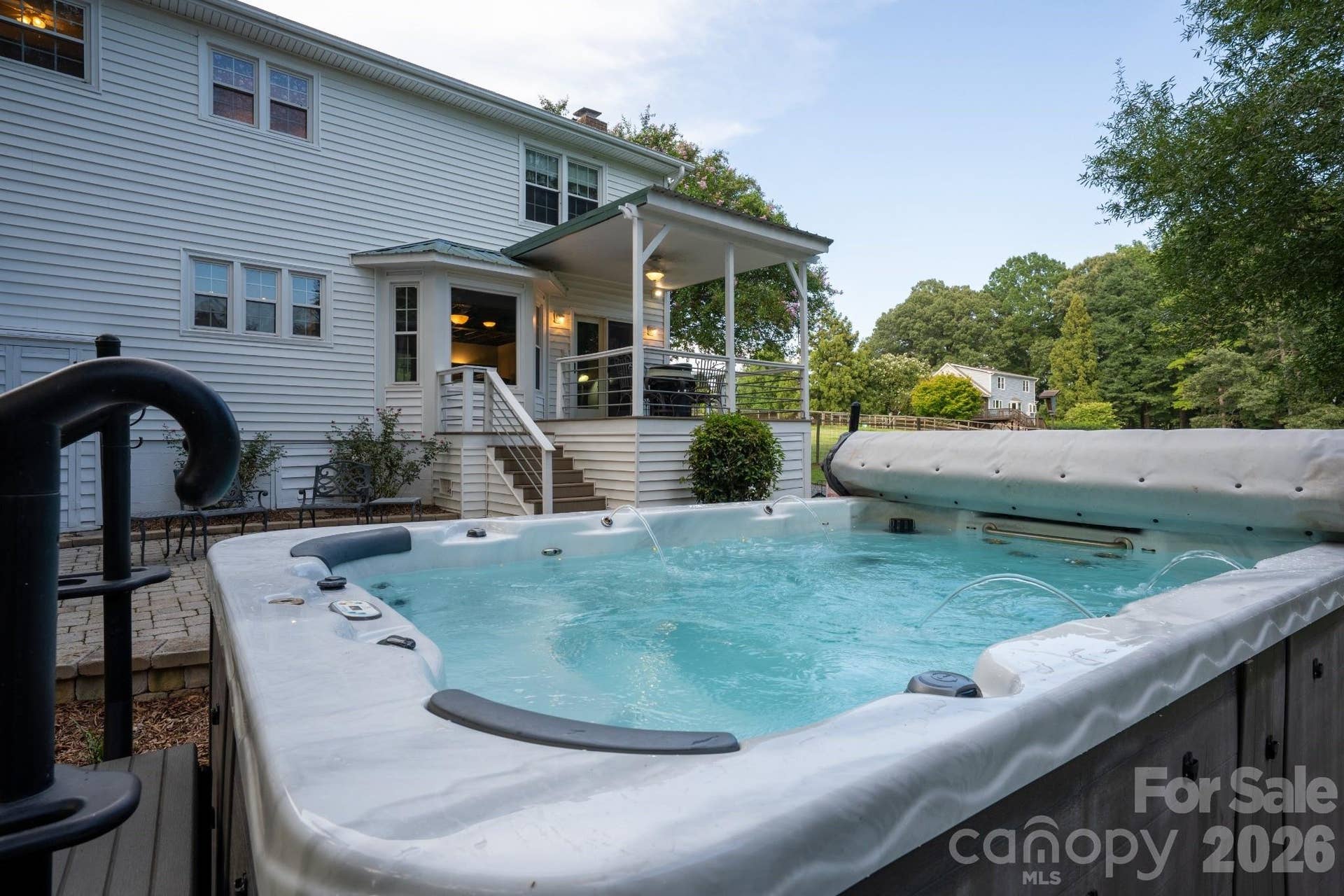 Swim spa with jets and fountains, perfect for relaxing after working on the farm