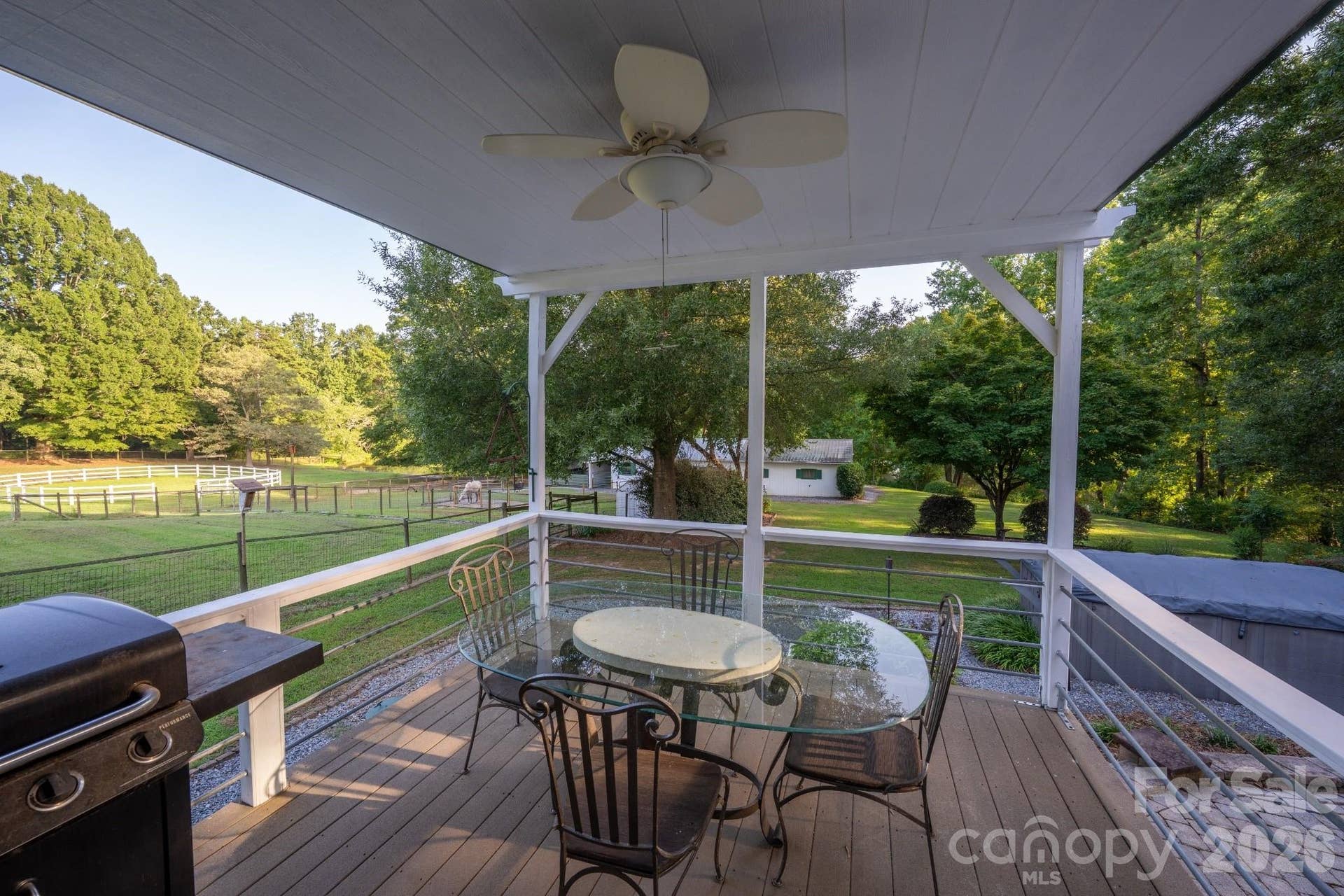 Ample outdoor living with beautiful farm views. Back porch w/ ceiling fan