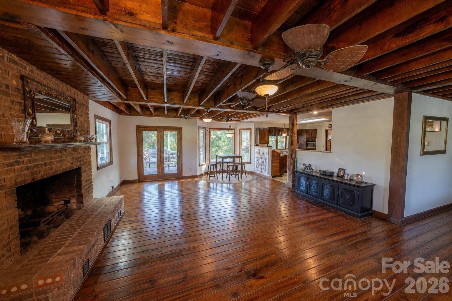 Beautiful hardwood floors and timber beam ceilings