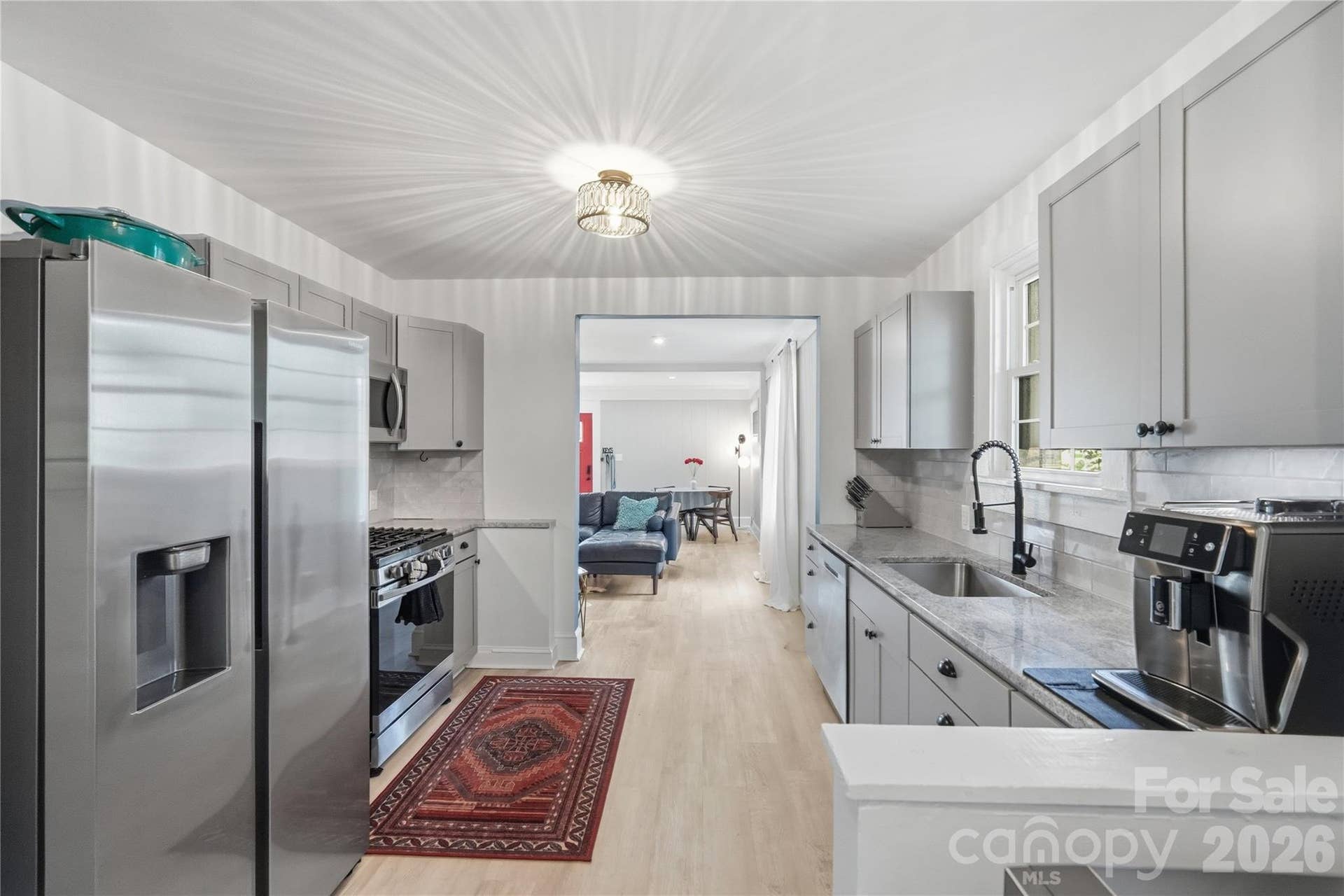 The kitchen opens directly into the living and dining space, making it easy to stay connected while cooking or entertaining.