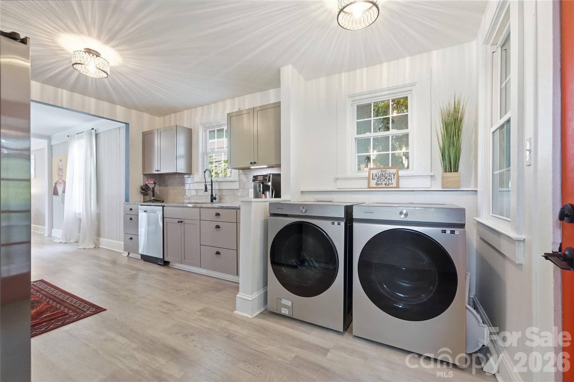 Tucked just off the kitchen, the laundry area keeps everyday routines simple, with plenty of natural light and easy flow between rooms.
