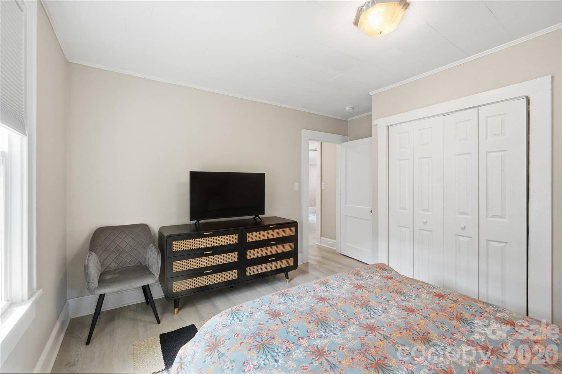 A generous closet and comfortable layout make this room easy to furnish and enjoy, just steps from the rest of the home.