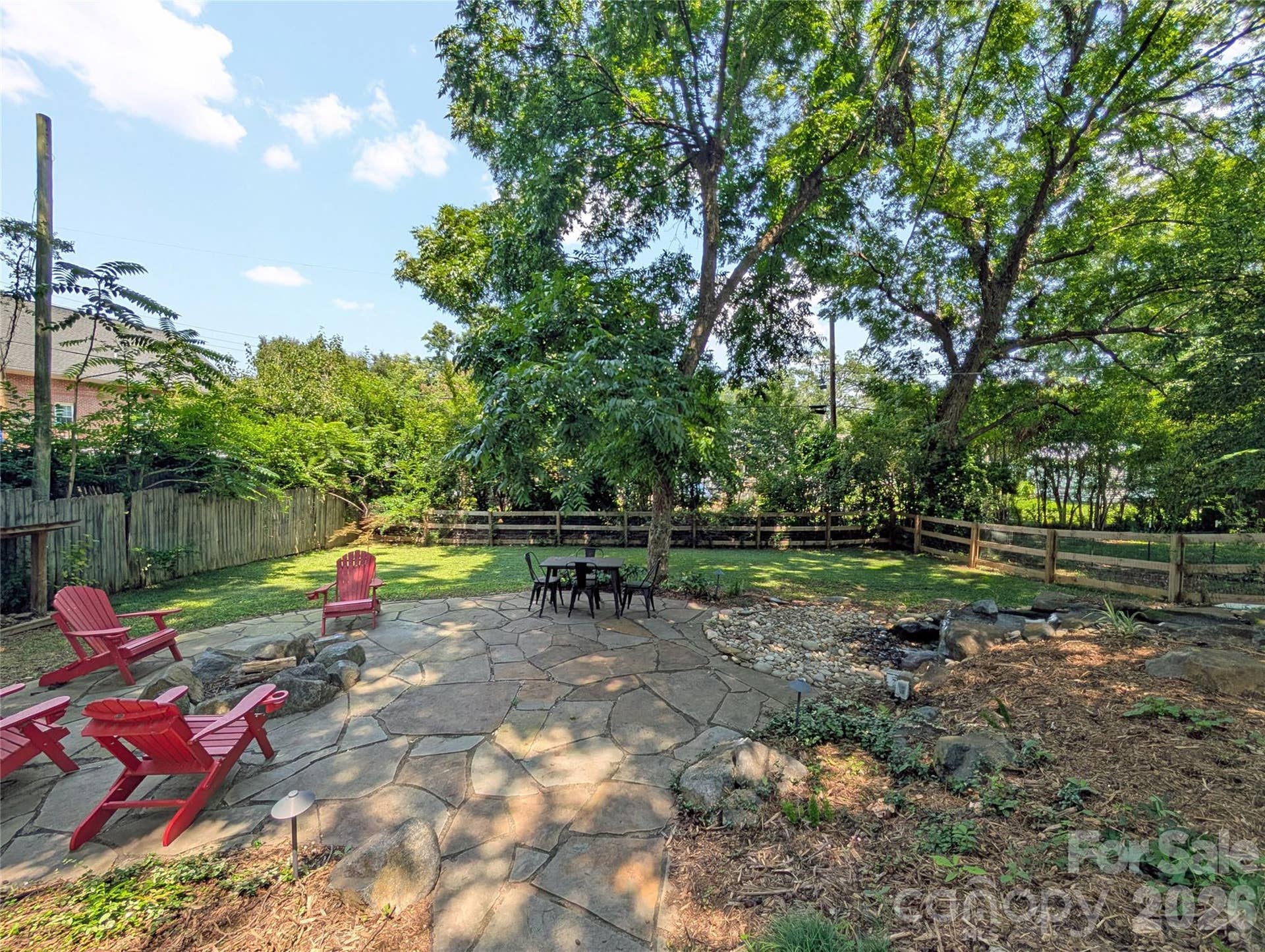 Beyond the patio, an additional grassy area gives you space for backyard games like cornhole, yard darts, or whatever you enjoy outside.