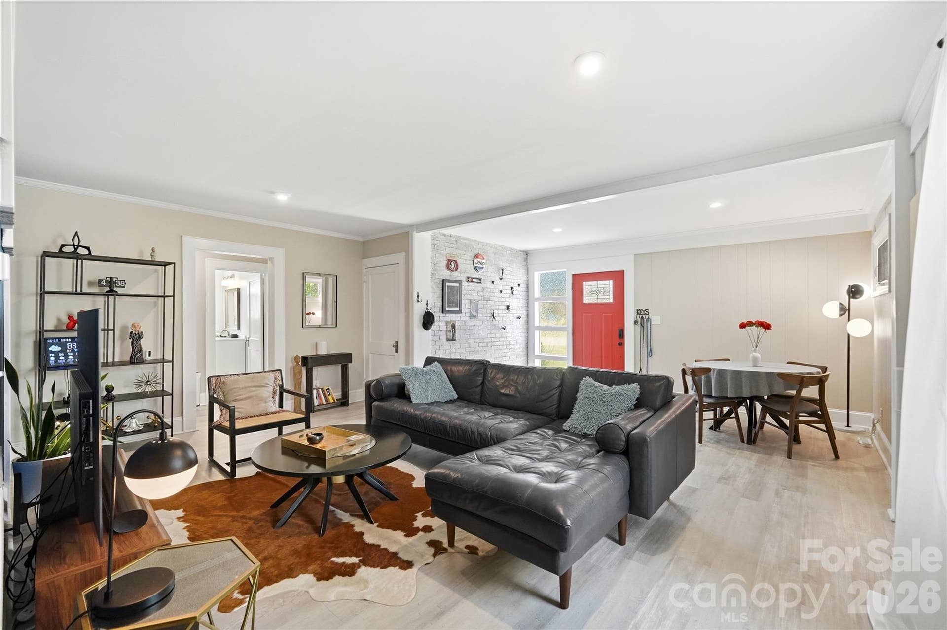 The open living and dining area flows easily from room to room, with LVP flooring throughout and plenty of natural light.