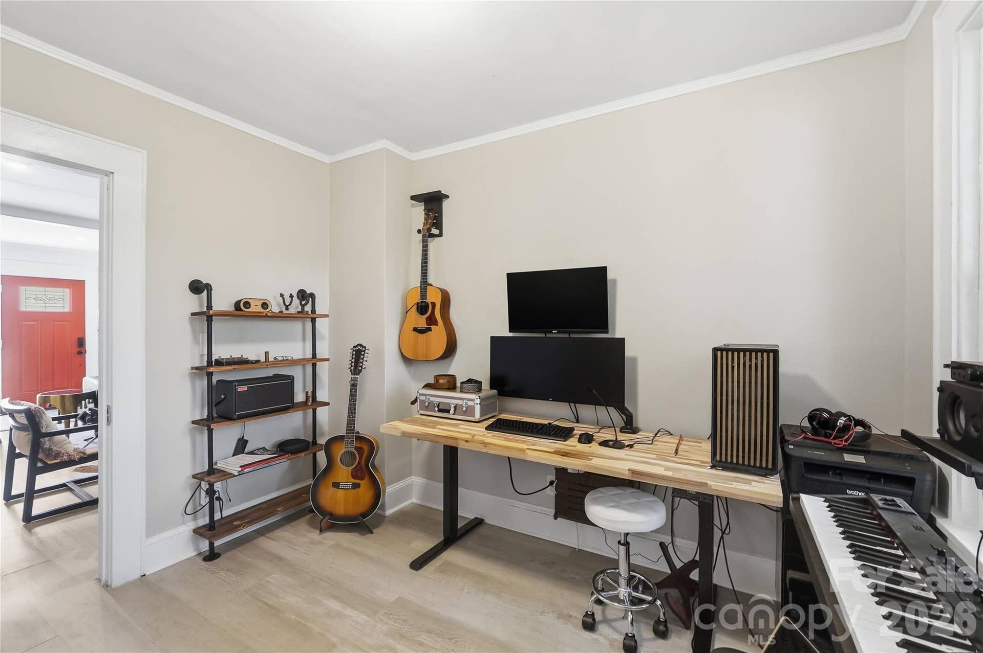 Natural light pours in through two windows, and a closet provides added storage for whatever the room is used for.