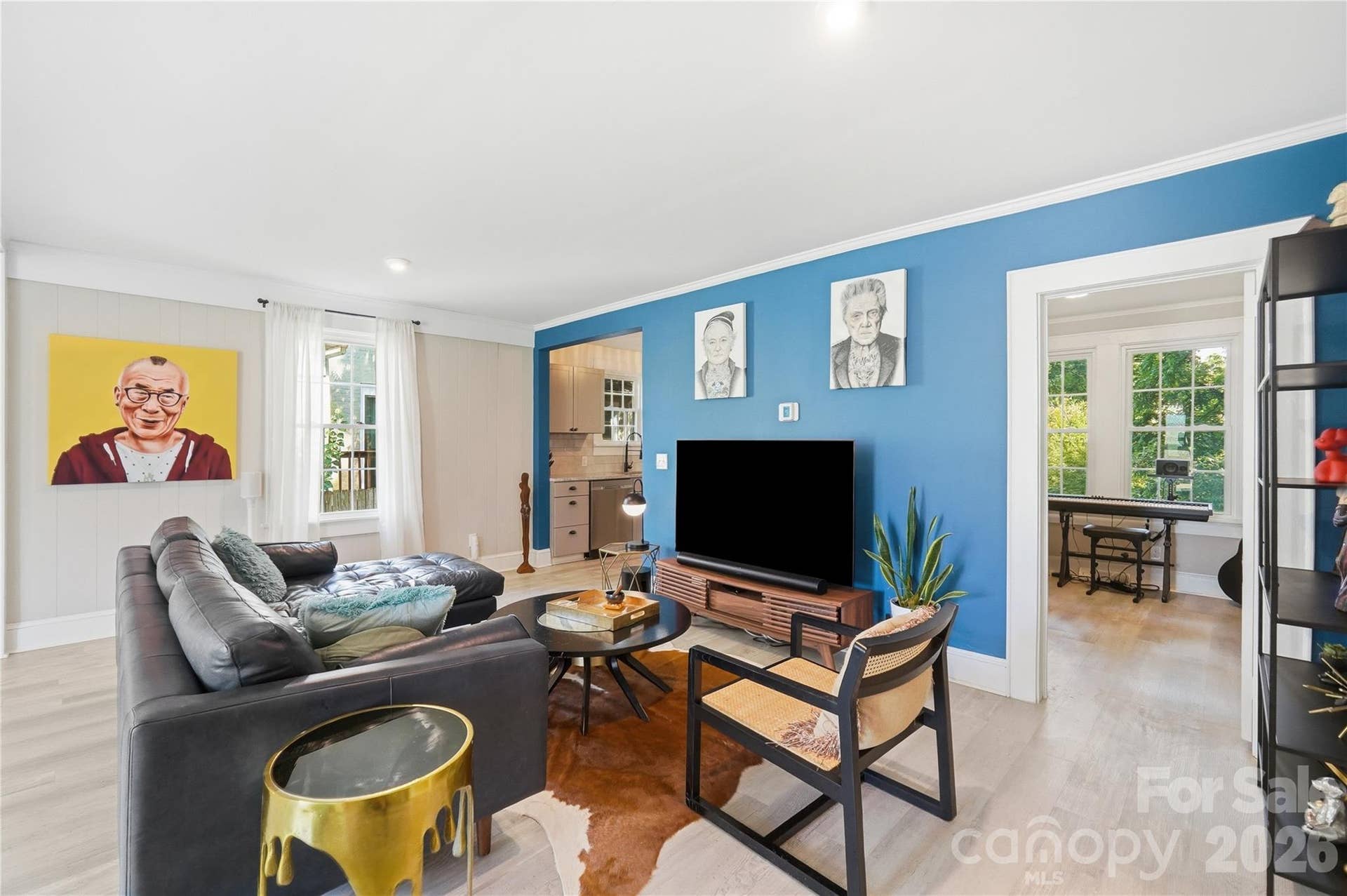 From the living room, sightlines open straight through to the kitchen and third bedroom, keeping the whole main level feeling connected and easy to move through.