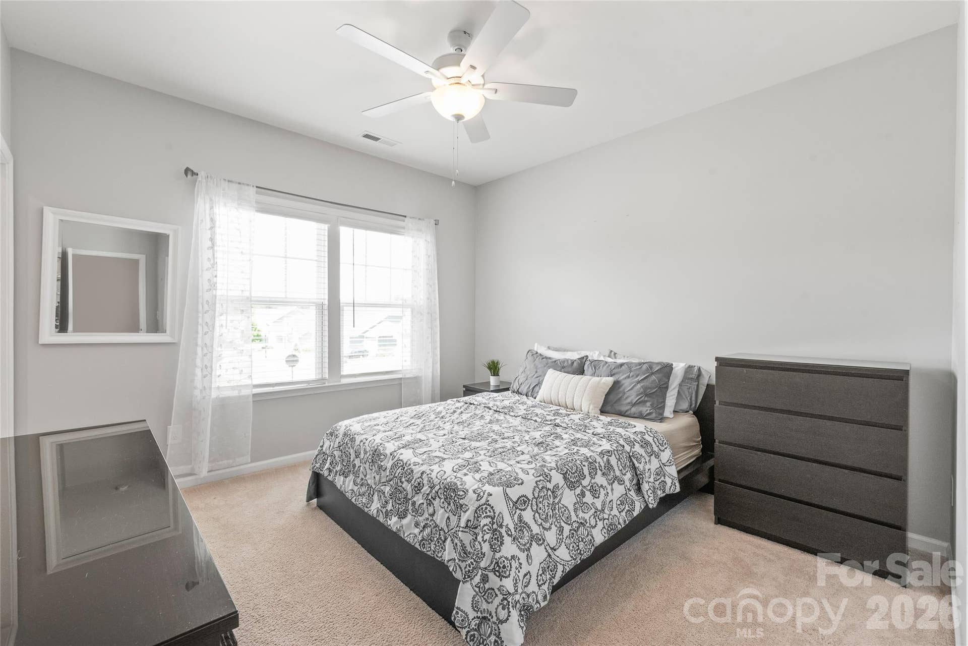 A spacious third bedroom offering a generous walk-in closet and seamless access to a shared Jack-and-Jill bathroom.