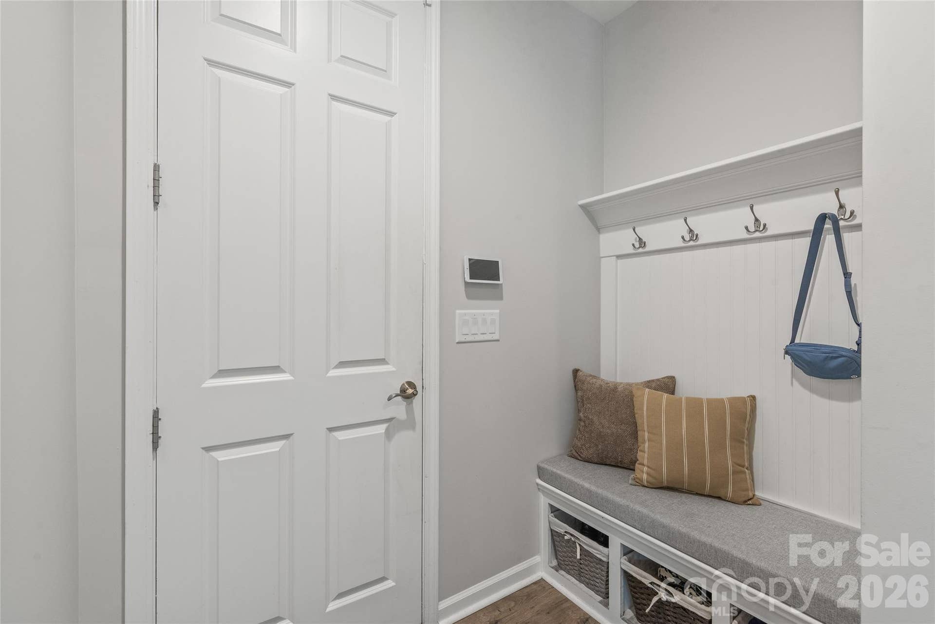 Located right off the garage entry, this convenient drop zone features built-in bench seating, storage cubbies, and coat hooks to keep daily clutter organized and out of sight.