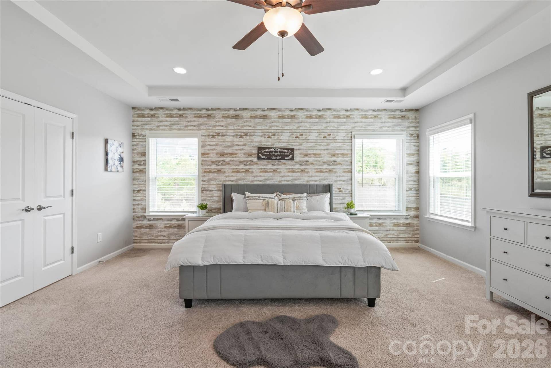 Elegant double doors open directly into the primary ensuite, creating a dramatic, spa-like entrance.