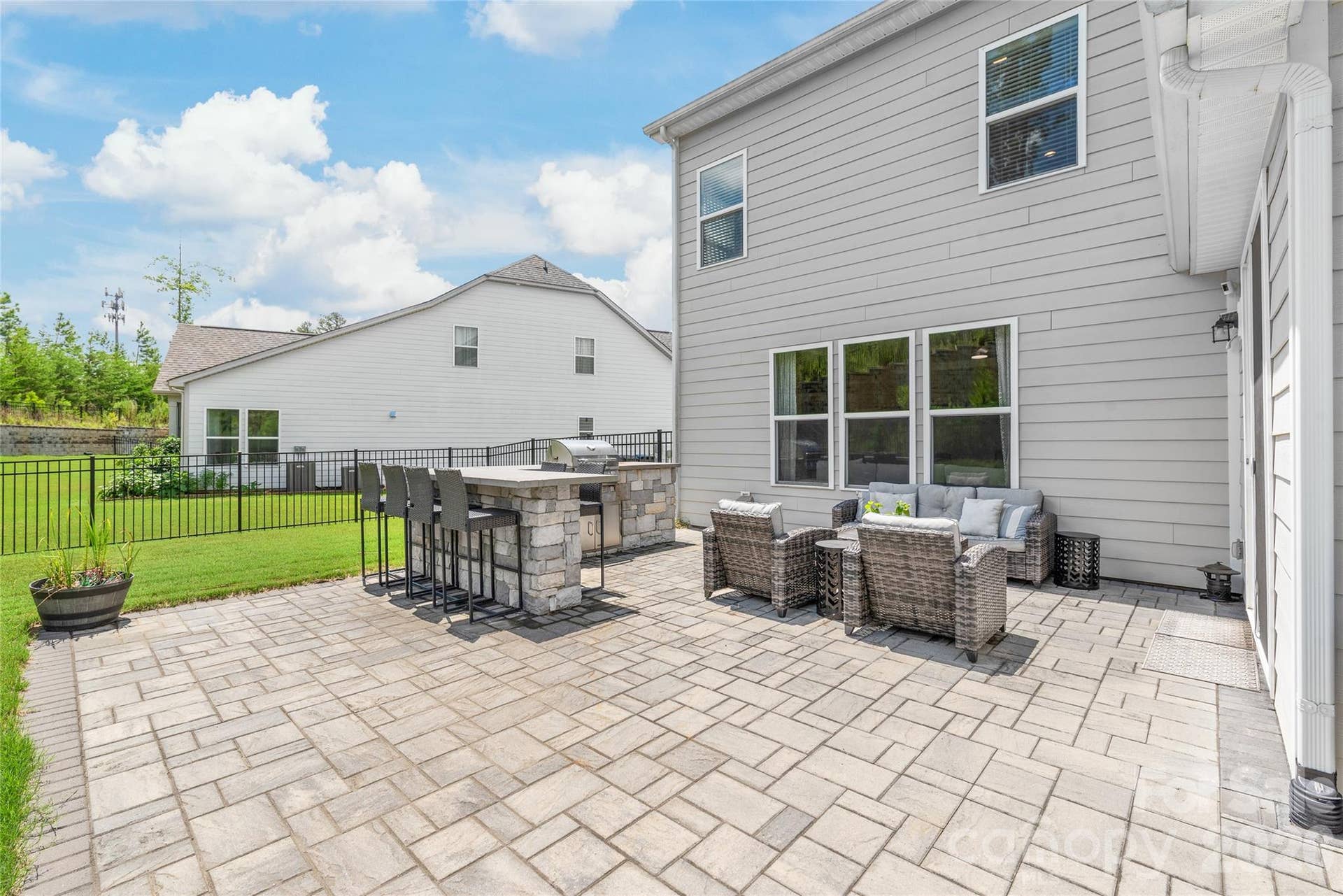 A spacious back patio offering a seamless transition to outdoor living and backyard enjoyment.
