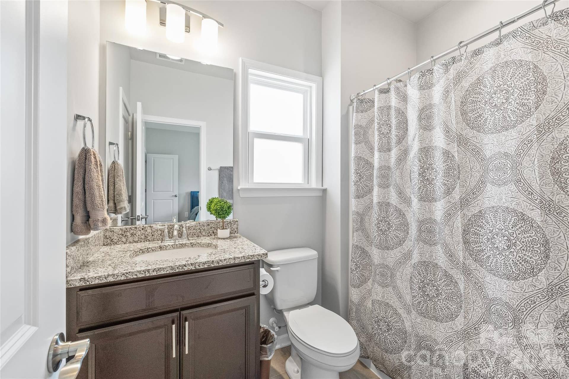 Serving both Bedroom 2 and the bonus room, this full bath delivers stylish finishes and seamless Jack-and-Jill accessibility.